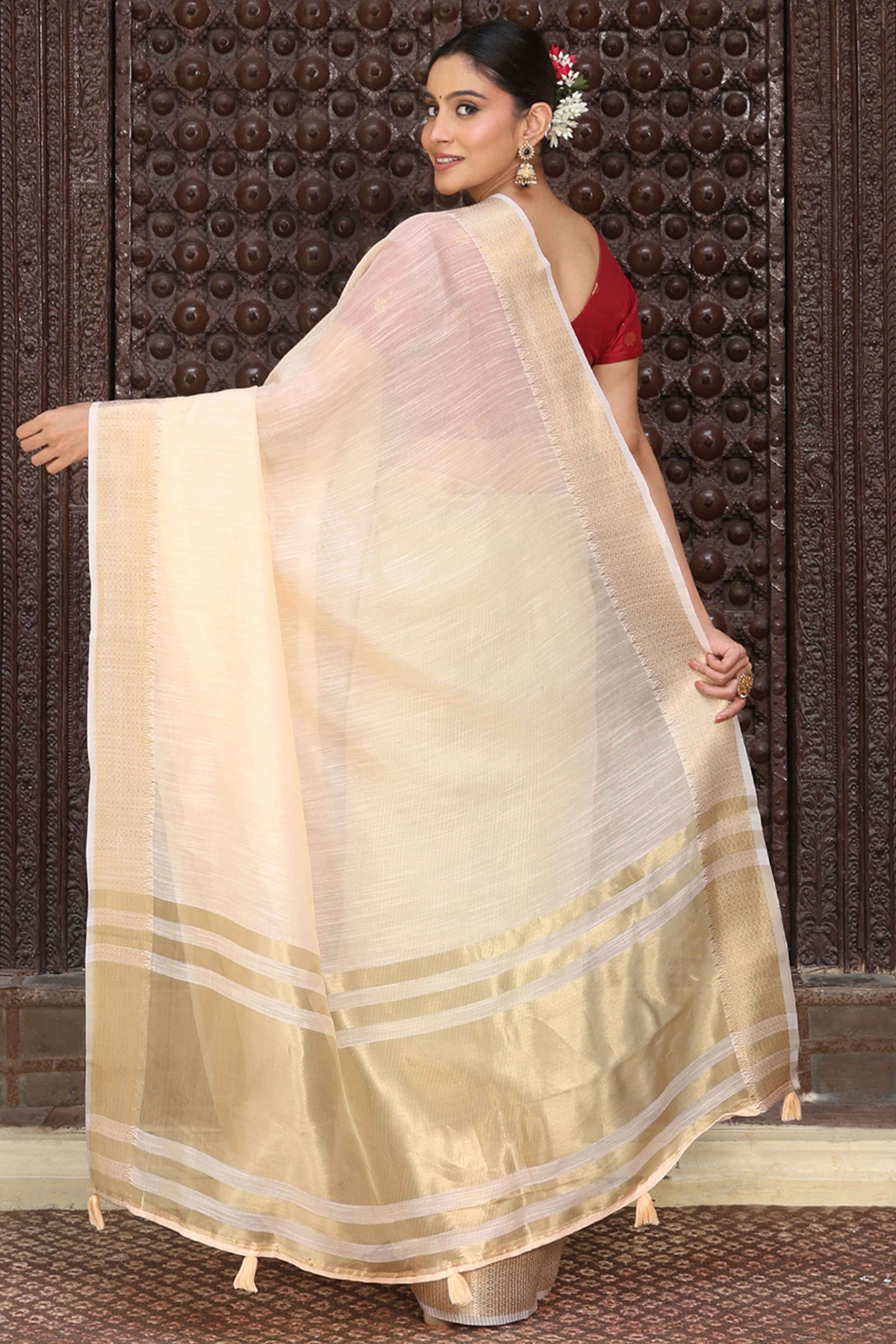 Charming Peach Zari Weaving Cotton Blend Saree Adorned With Stylish Tassel Detailing