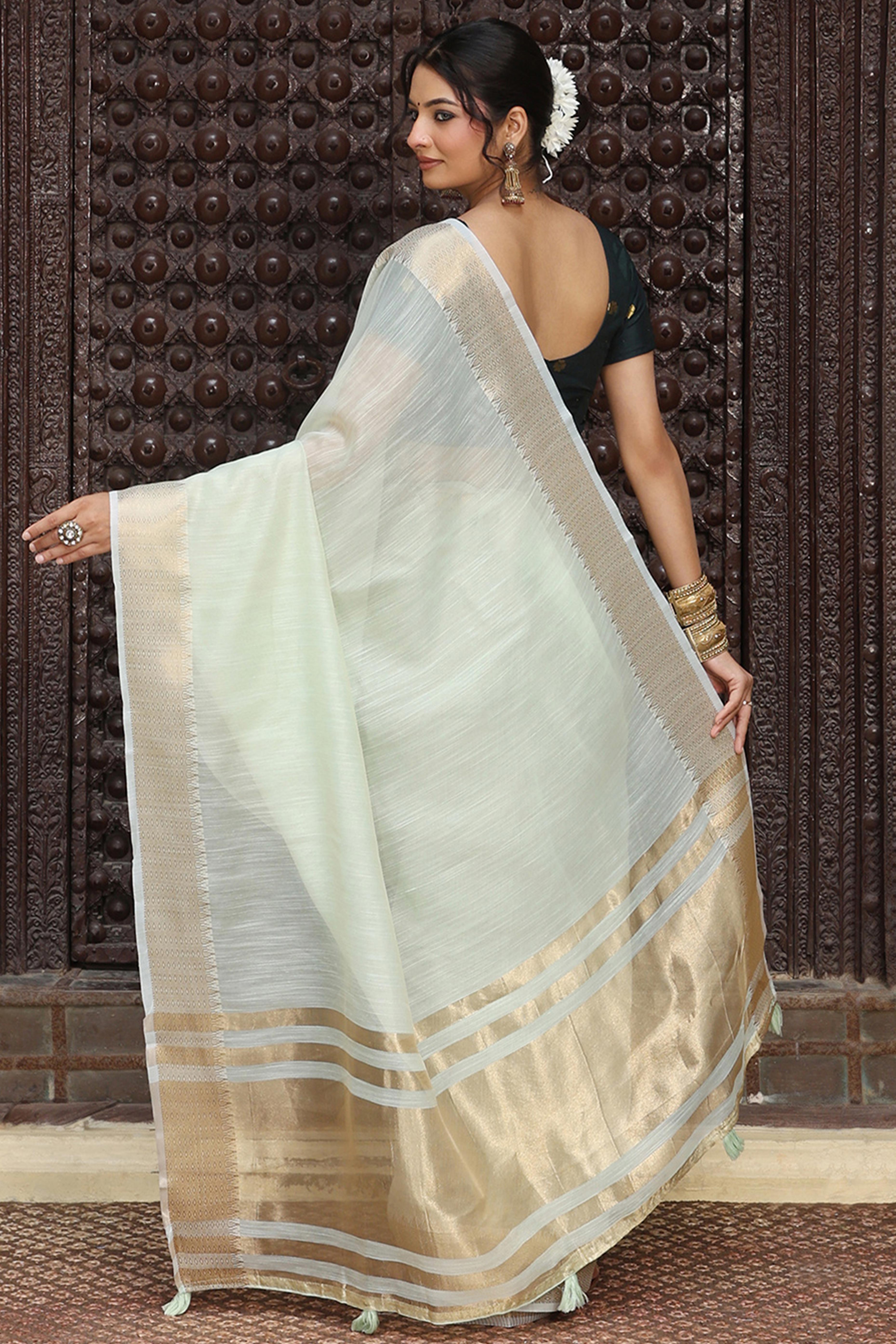Charming Light Sea Green Zari Weaving Cotton Blend Saree Adorned With Stylish Tassel Detailing