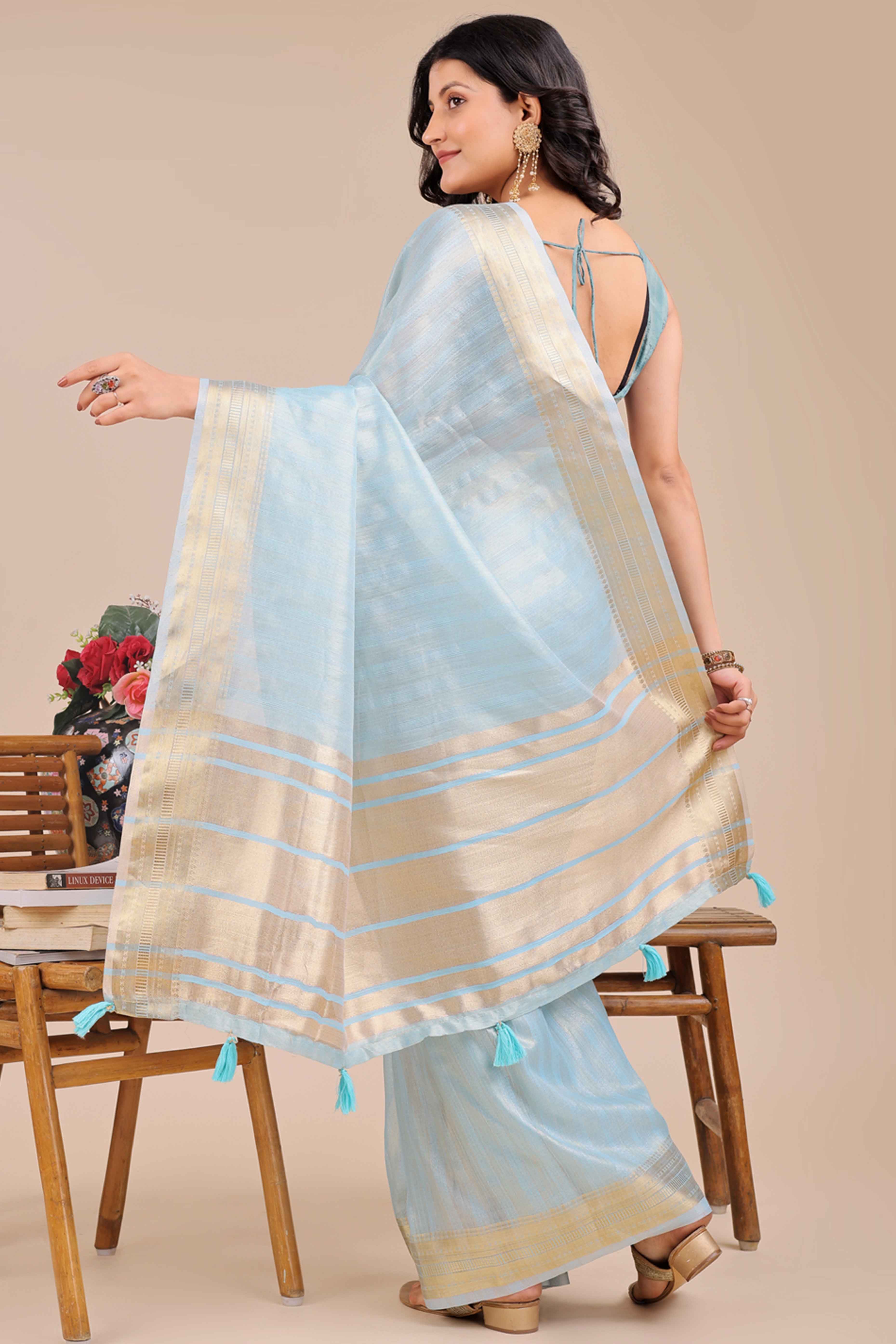 Sky Blue Organza Saree With Intricate Weave & Elegant Tassel Accents