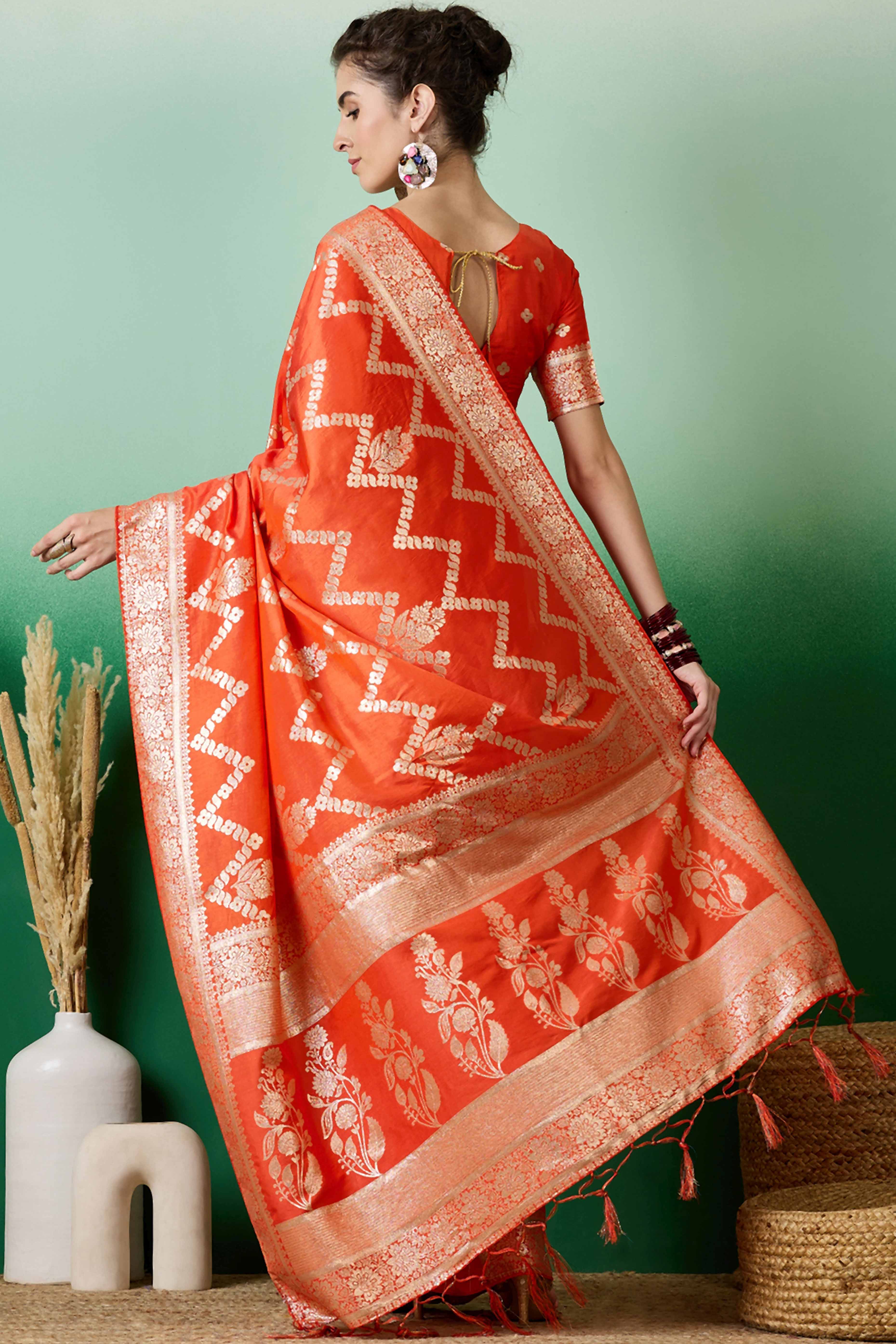 Orange Cotton Blend Jacquard Saree Adorned With Floral Weaving & Graceful Tassel Pallu