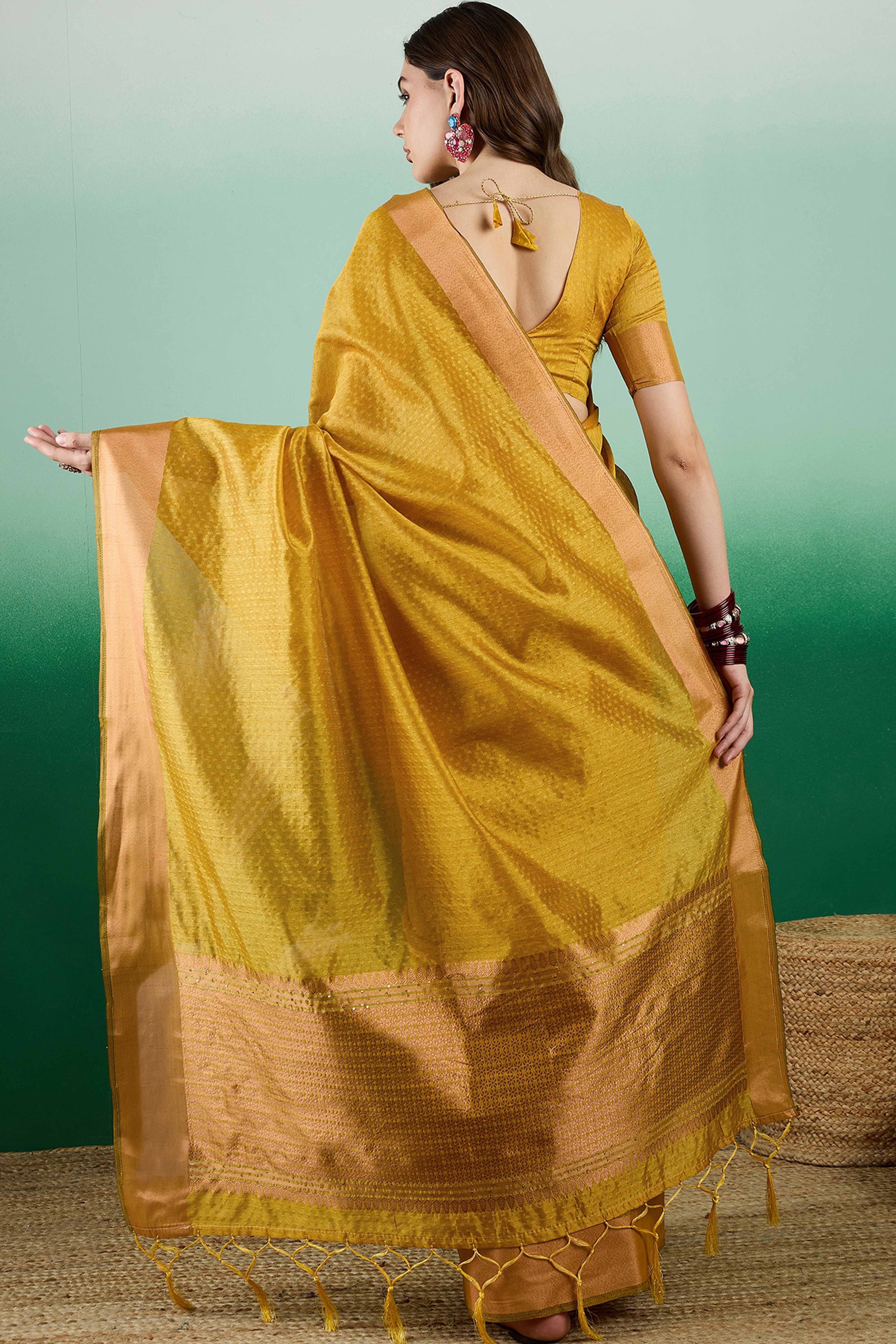 Mustard Khadi Organza Saree Intricate Weaving & Sparkling Sequins with Tassel Pallu