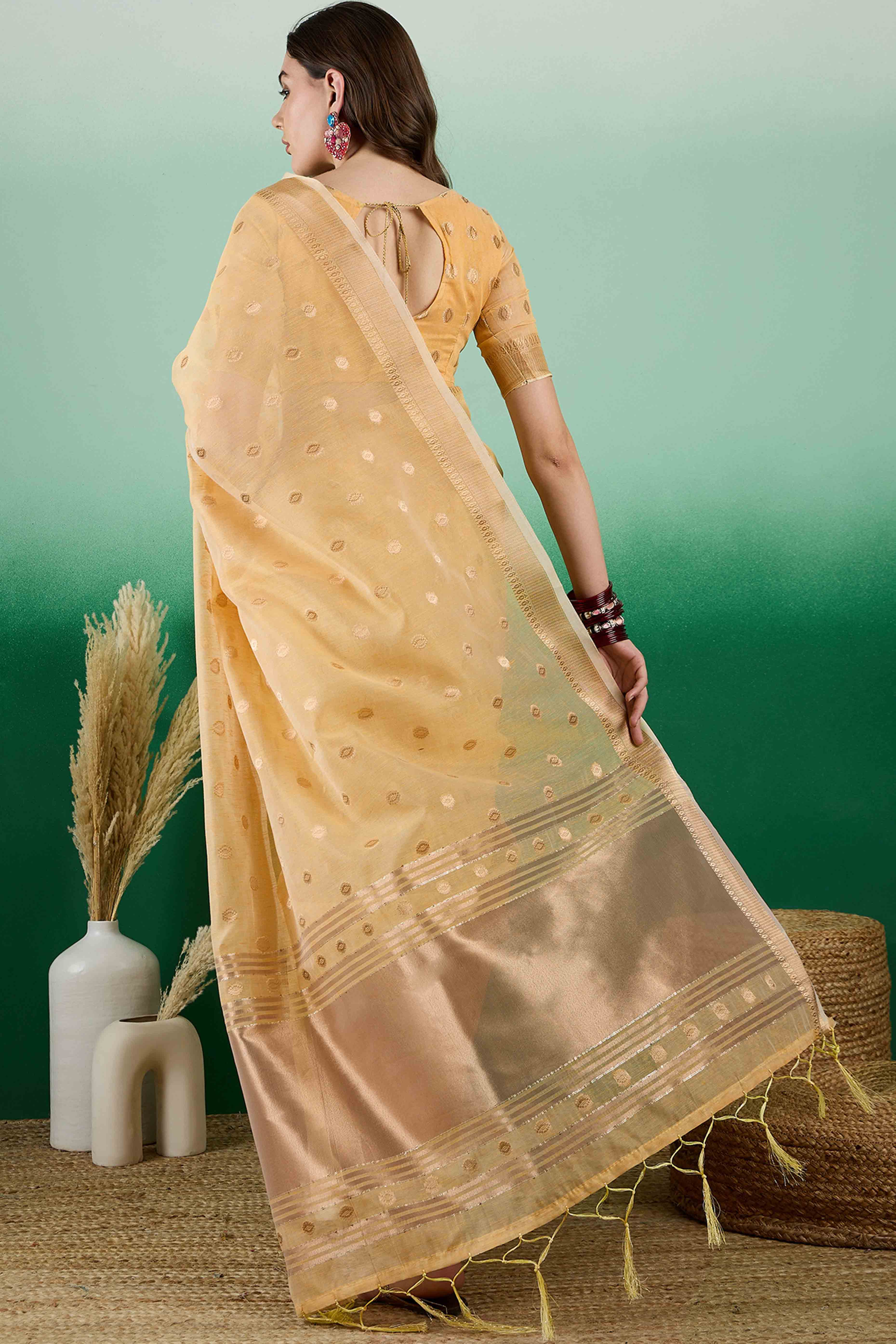 Yellow Khadi Organza Saree Embellished With Traditional Zari Work & Tassels