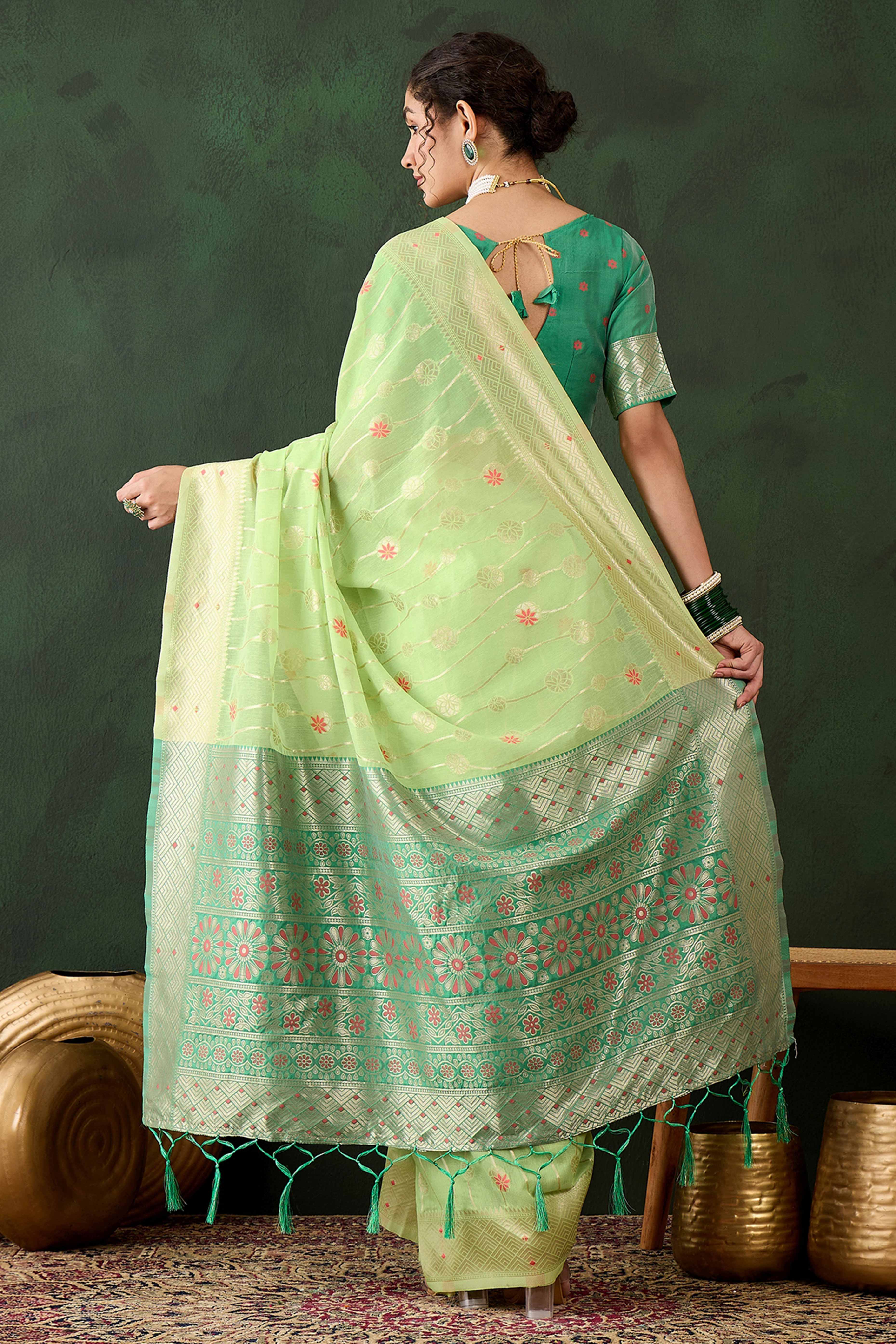 Green Cotton Blend Saree Adorned With Intricate Floral Zari Weaving & A Stylish Tassel Pallu