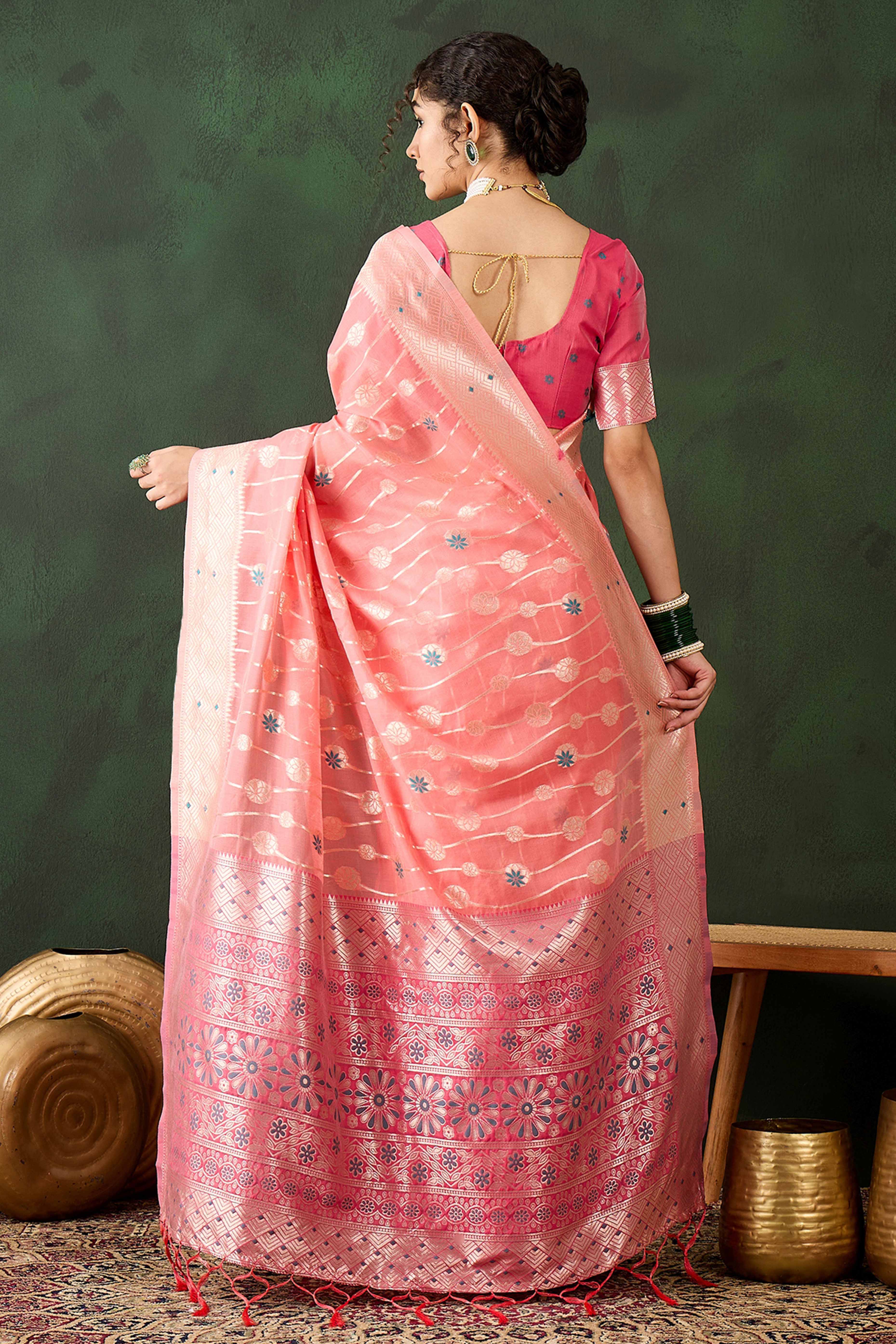 Peach Cotton Blend Saree Adorned With Intricate Floral Zari Weaving & A Stylish Tassel Pallu