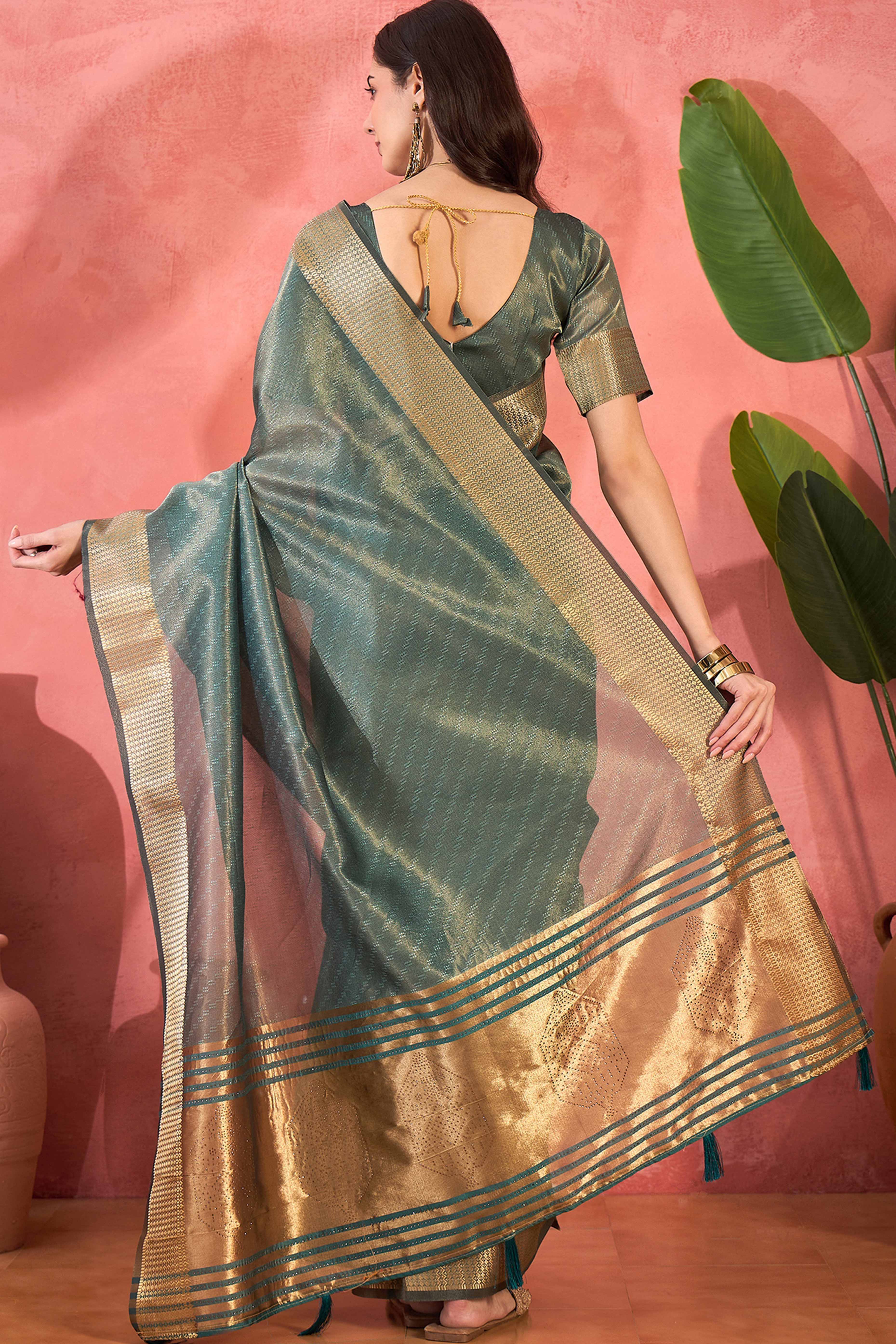 Teal Green Khadi Organza Saree Intricate Weaving & Sparkling Stonework With Tassel Pallu