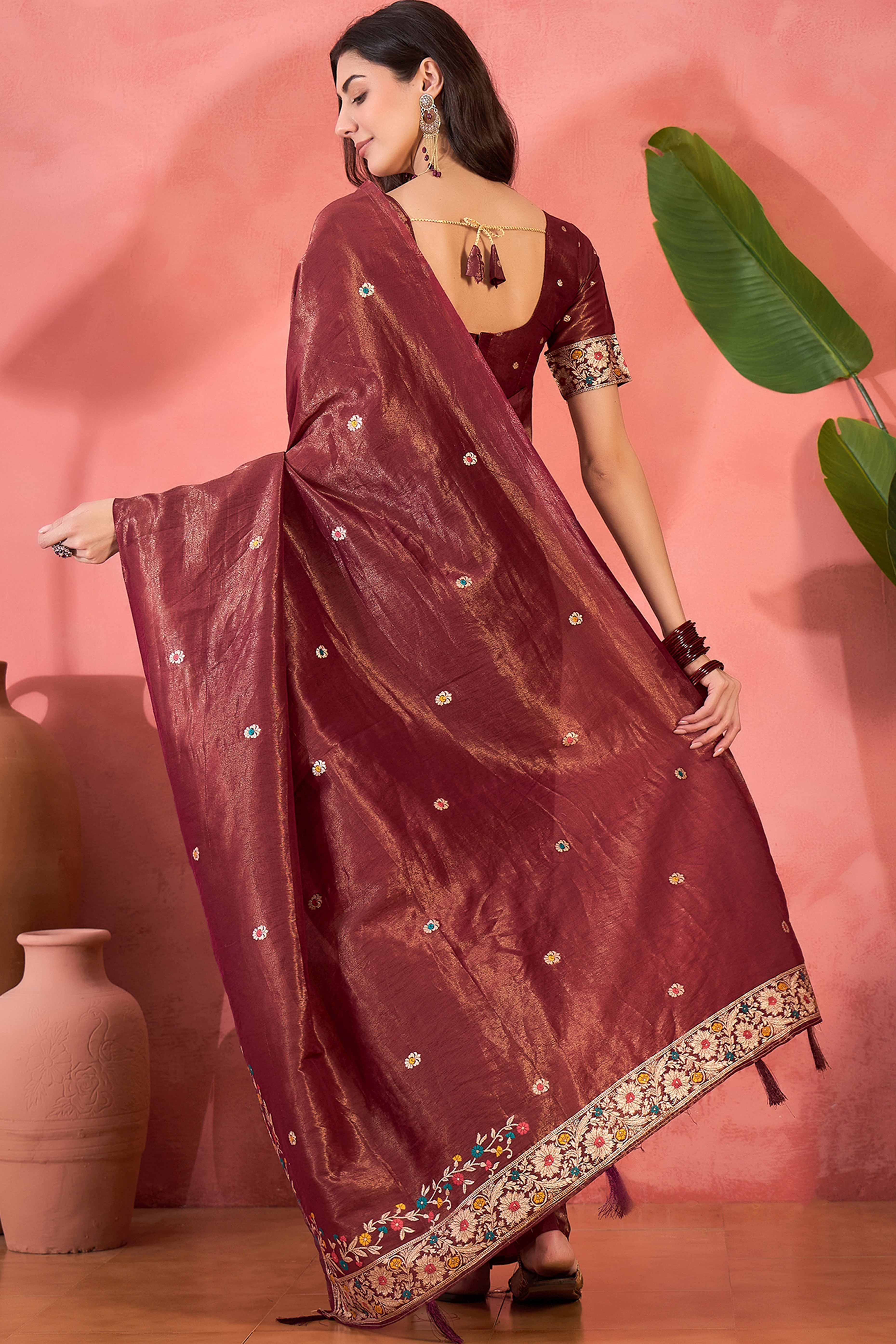 Maroon Zari Woven Shimmer Saree With Floral Motifs & Flowing Tassel Pallu
