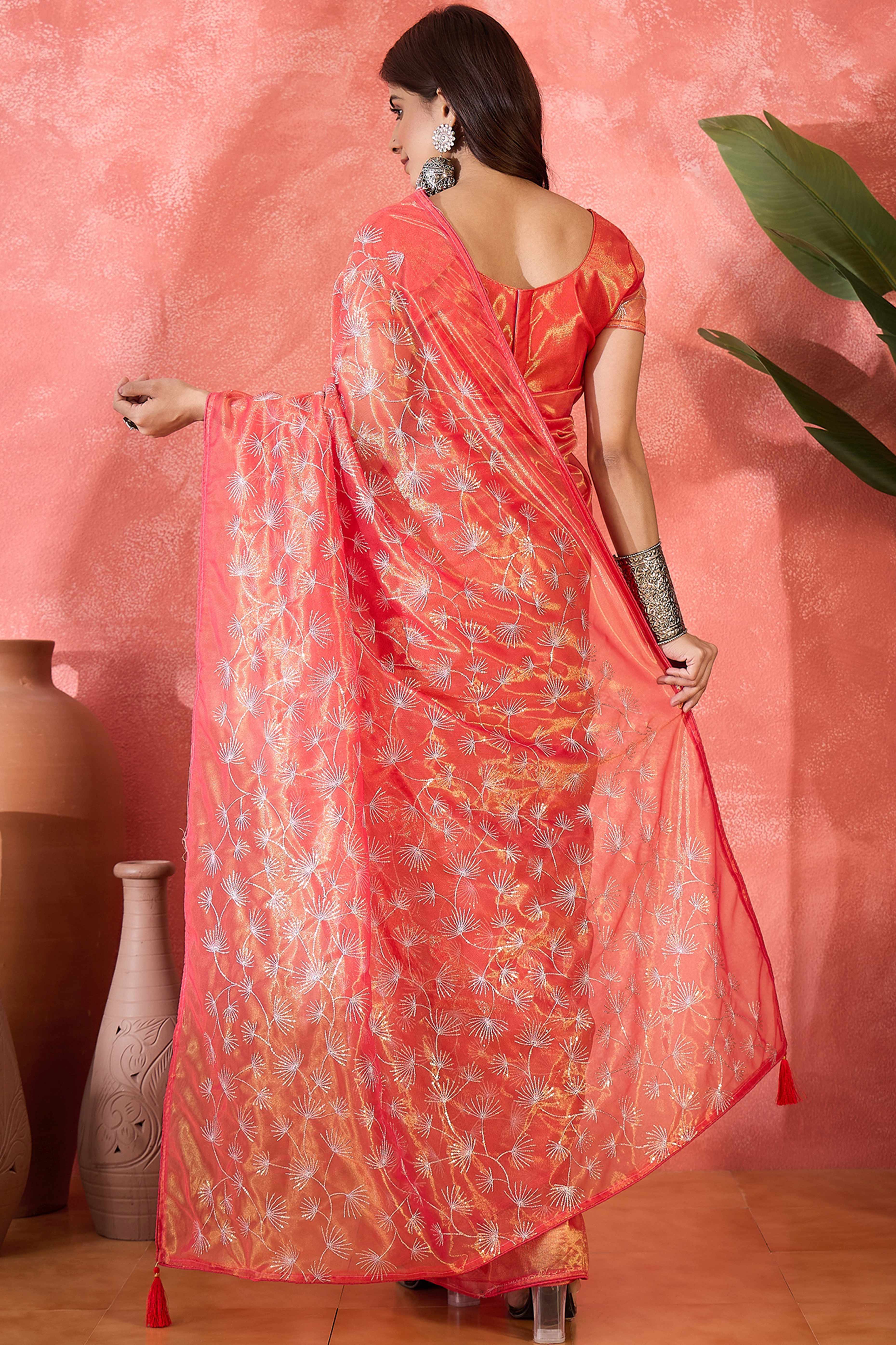 Rust Orange Twill Net Saree With Intricate Floral Sequin Work & Flowing Tassel Pallu
