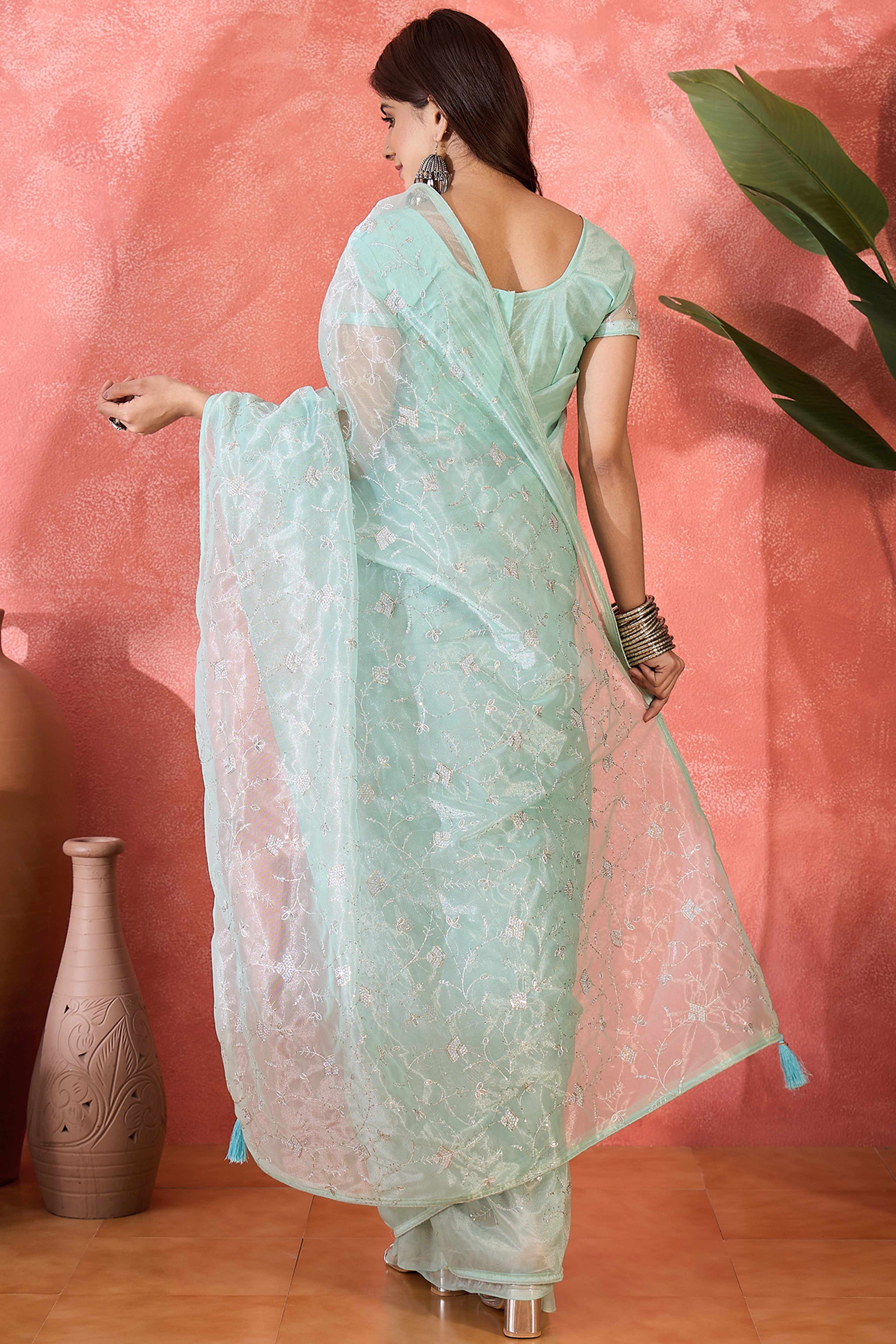 Pale Turquoise Floral Sequin Embellished Saree In Twill Net With Tassel Accents