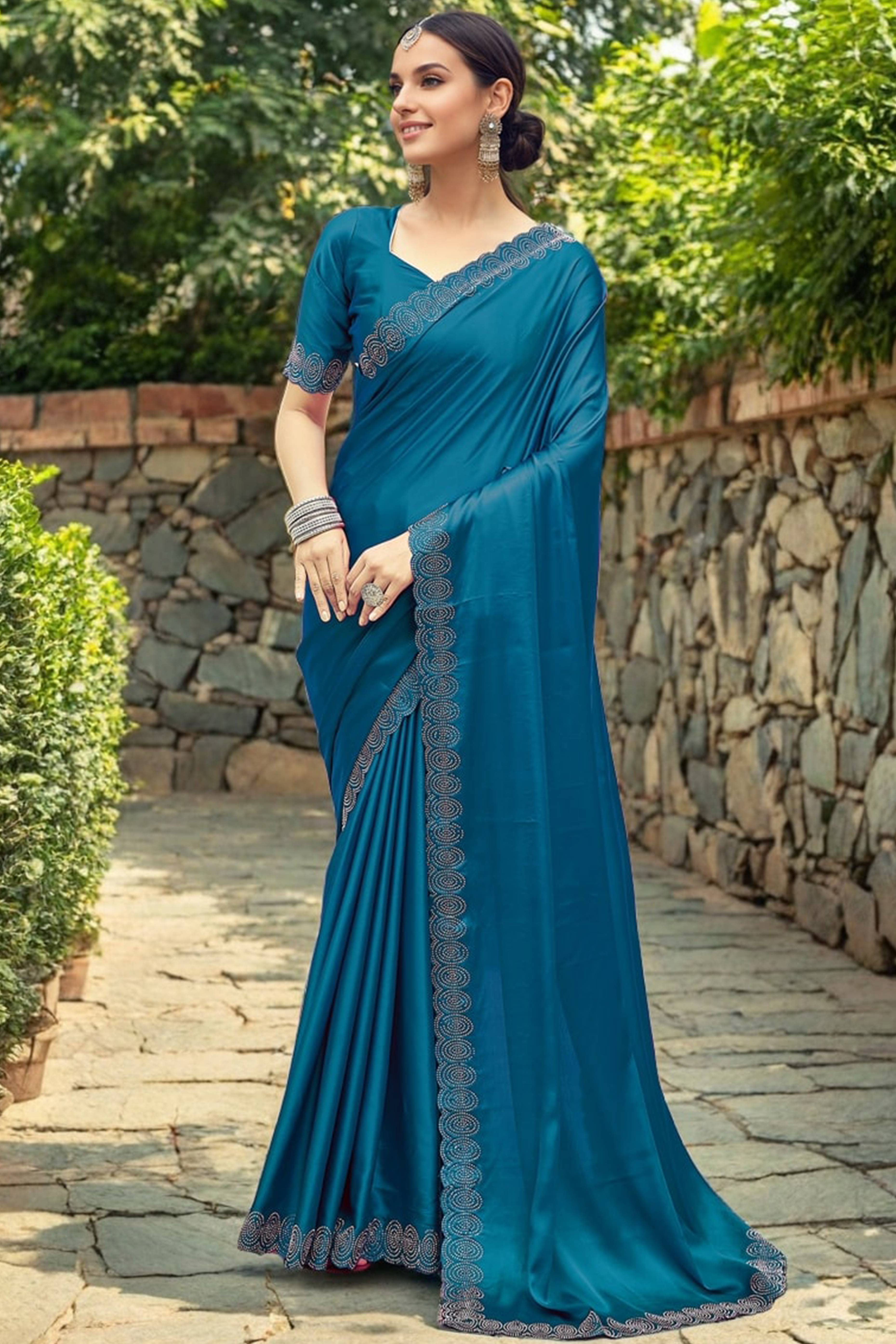 Teal Blue Solid Rangoli Dola Silk Saree Featuring Sparkling Swarovski Work Border