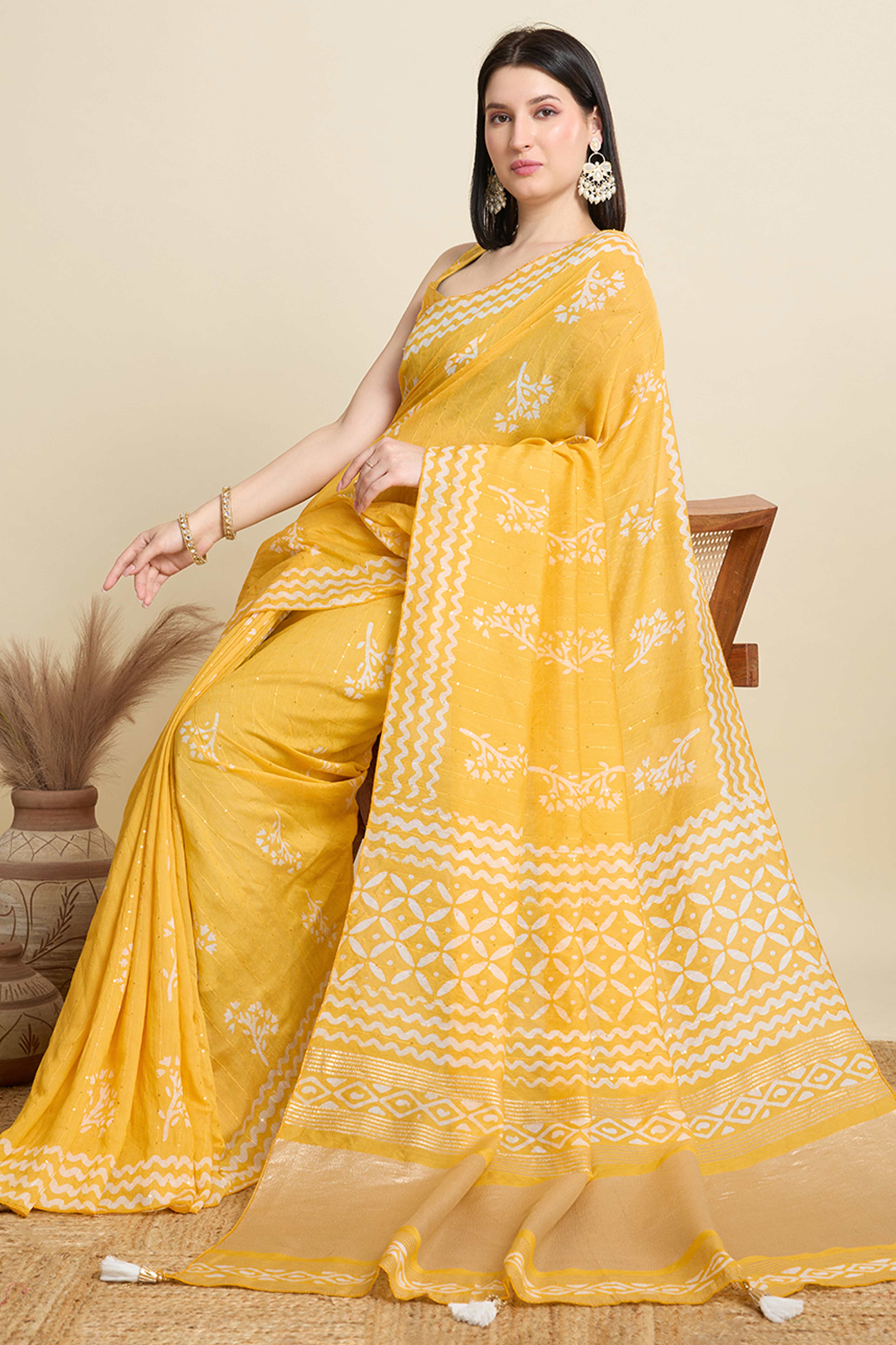 Yellow Cotton Blend Saree Featuring Floral Prints and Elegant Sequins Work Accents