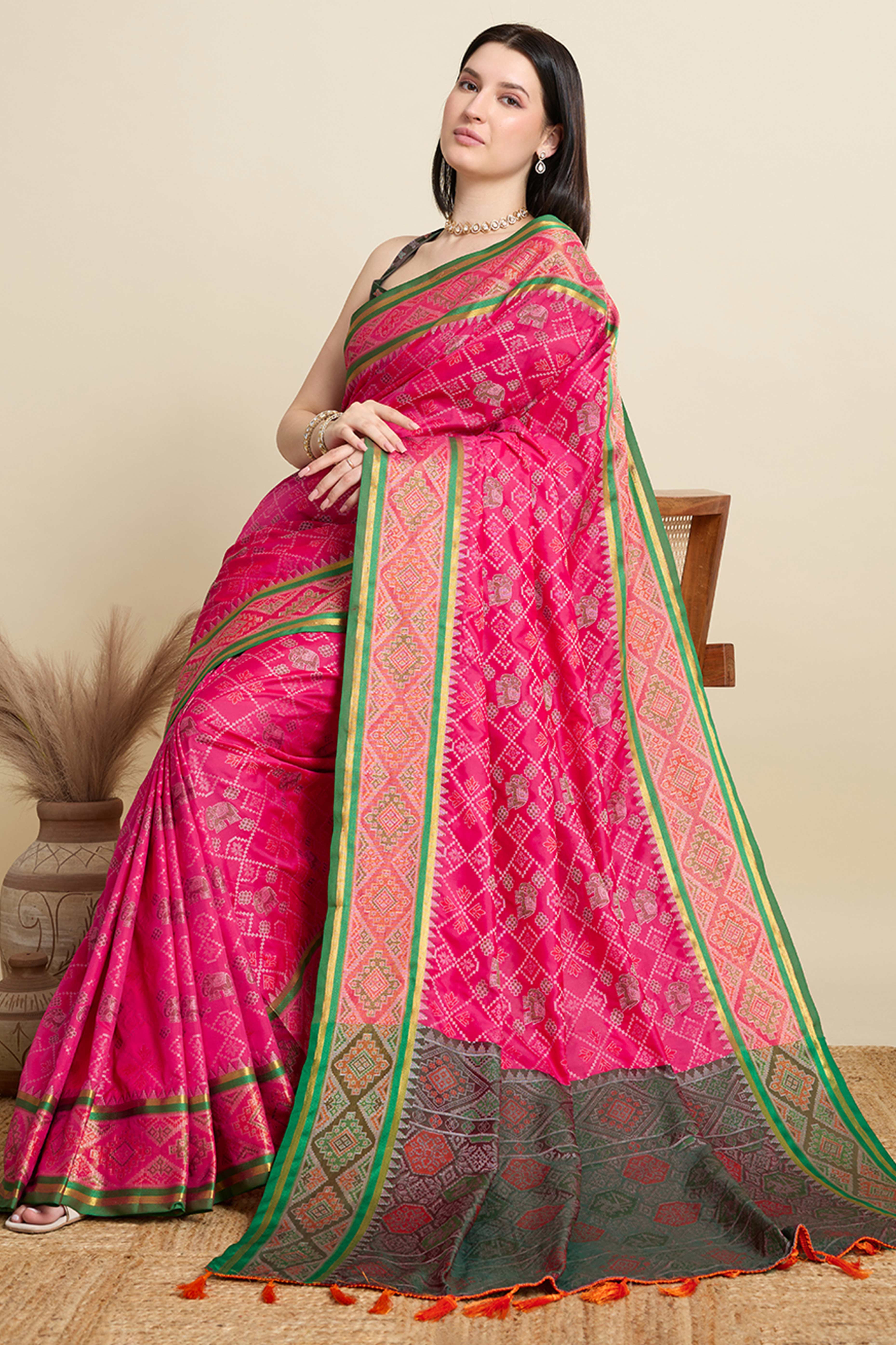Pink Silk Blend Saree Featuring Patola Prints and a Detailed Weaving Border