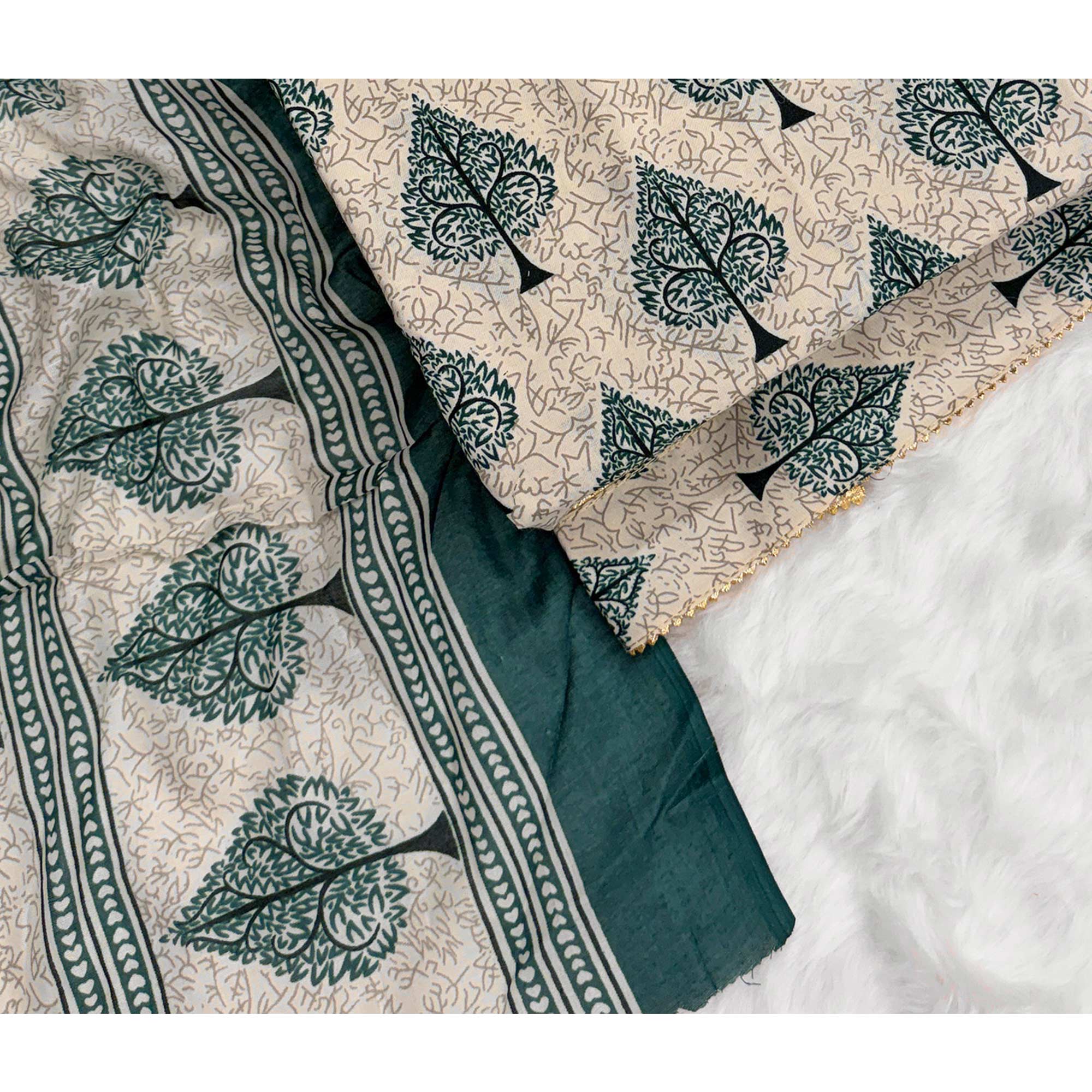 Vibrant Teal Green Leaf Printed Cotton Blend Dress Material Refined With Lace Border