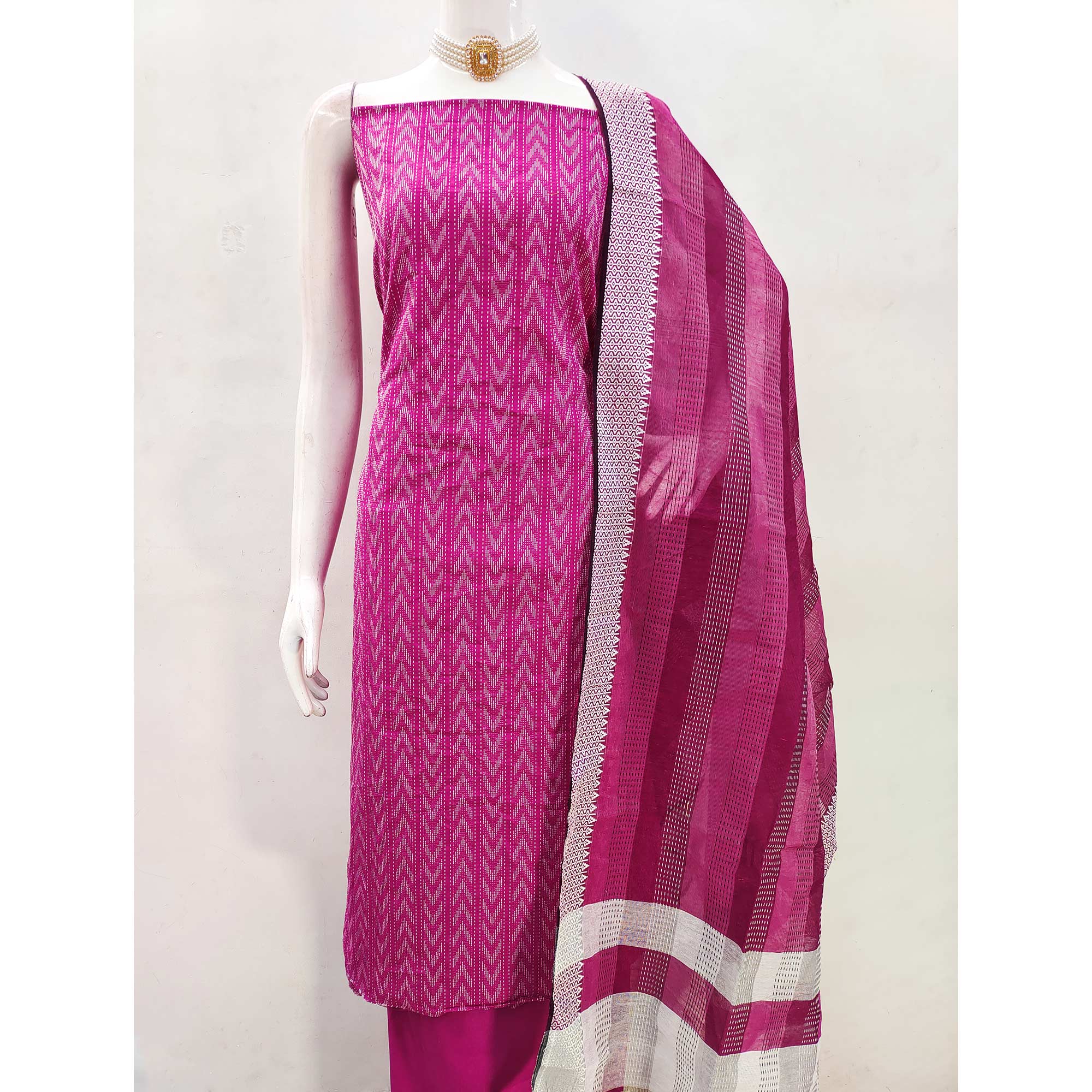 Redefine Elegance With This Pink Chevron Woven Pattern Cotton Blend Dress Material