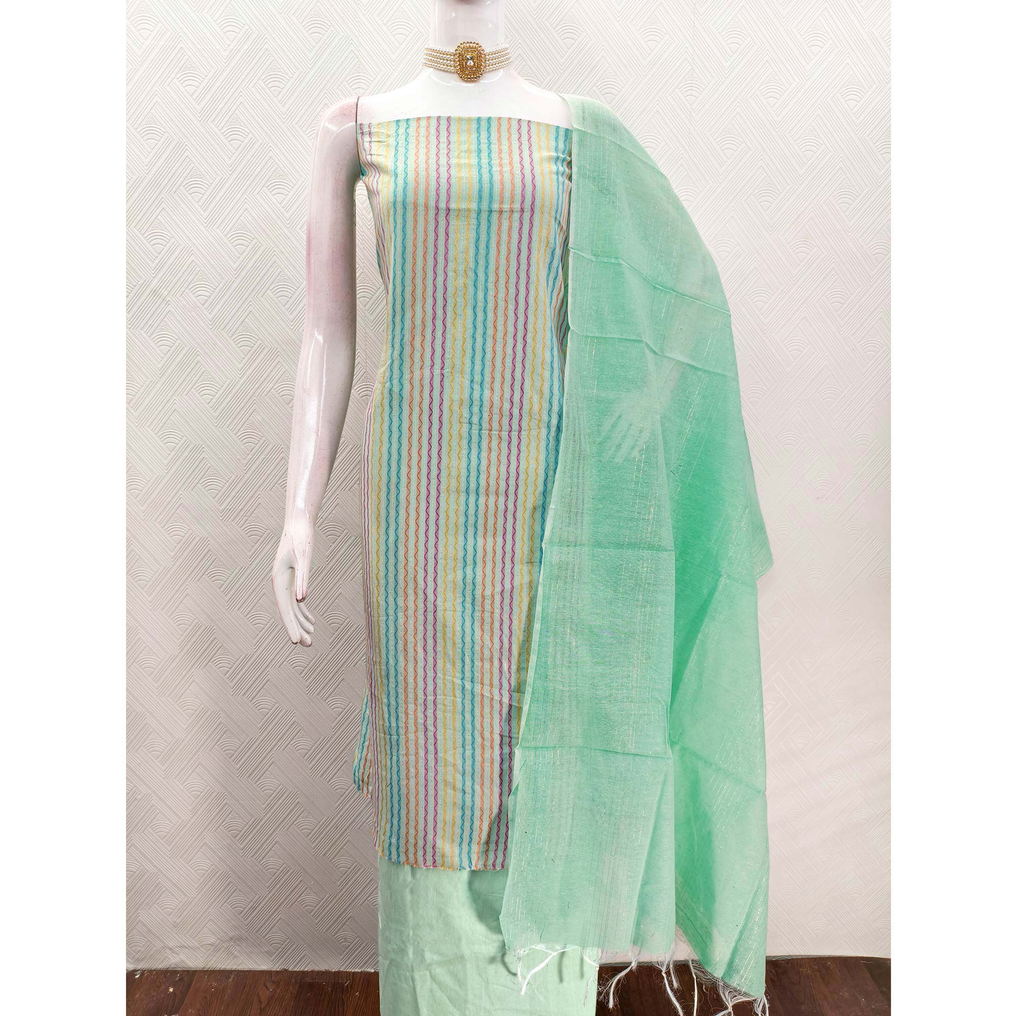 Sea Green Poly Cotton Blend Dress Material Highlighted With Striped Woven Work