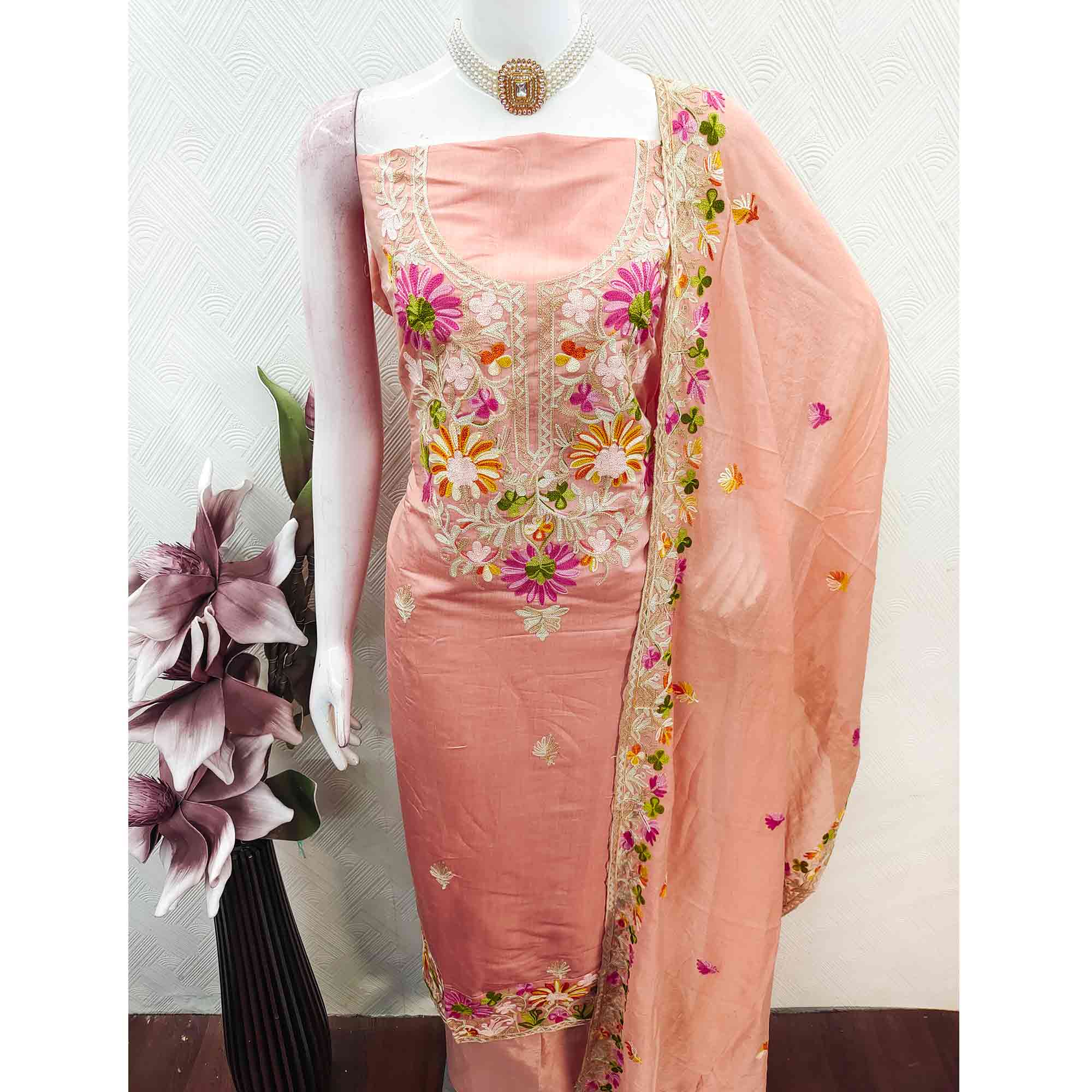 Peach Designer Roman Art Silk Dress Material Adorned With Floral Thread Embroidery Work