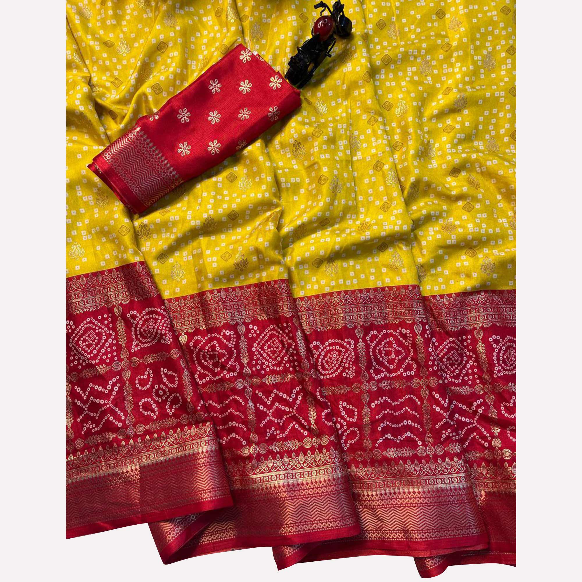 Yellow & Red Dola Silk Saree Featuring Traditional Bandhani Print & Woven Border