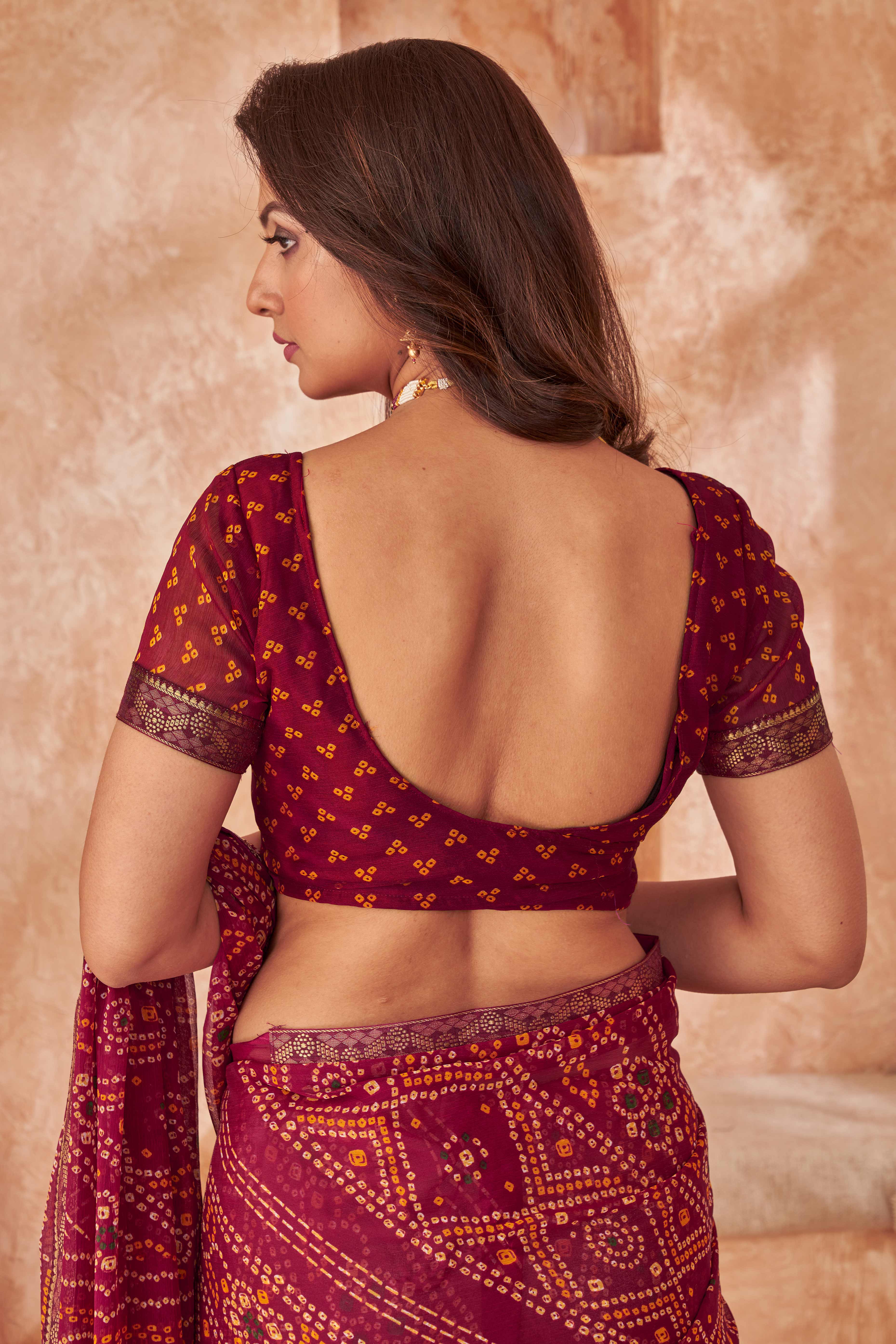 Maroon Chiffon Saree Featuring Traditional Bandhani Prints & A Graceful Lace Edge