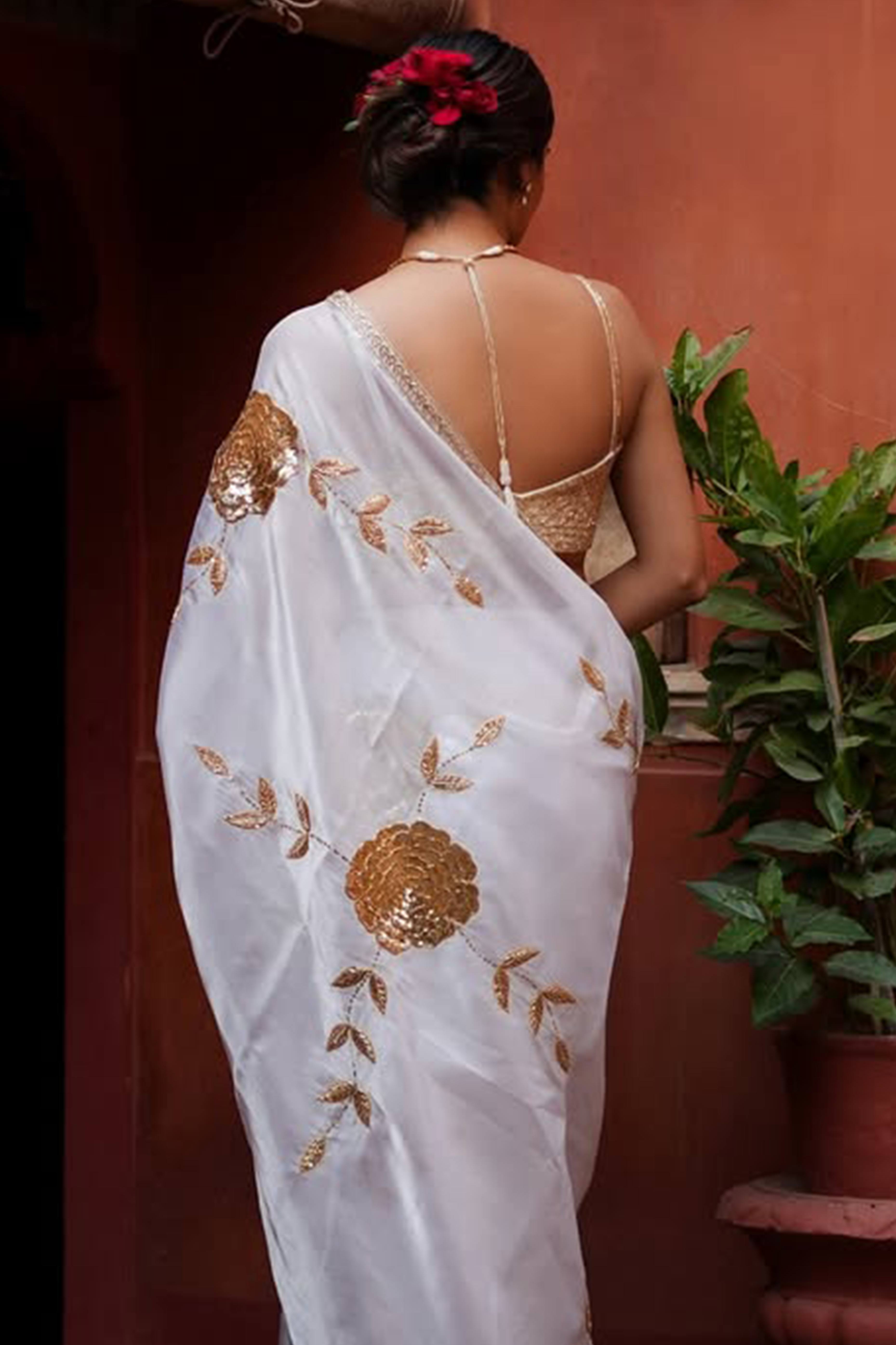 White Silk Blend Saree Featuring Delicate Floral Motifs in Shimmering Sequins
