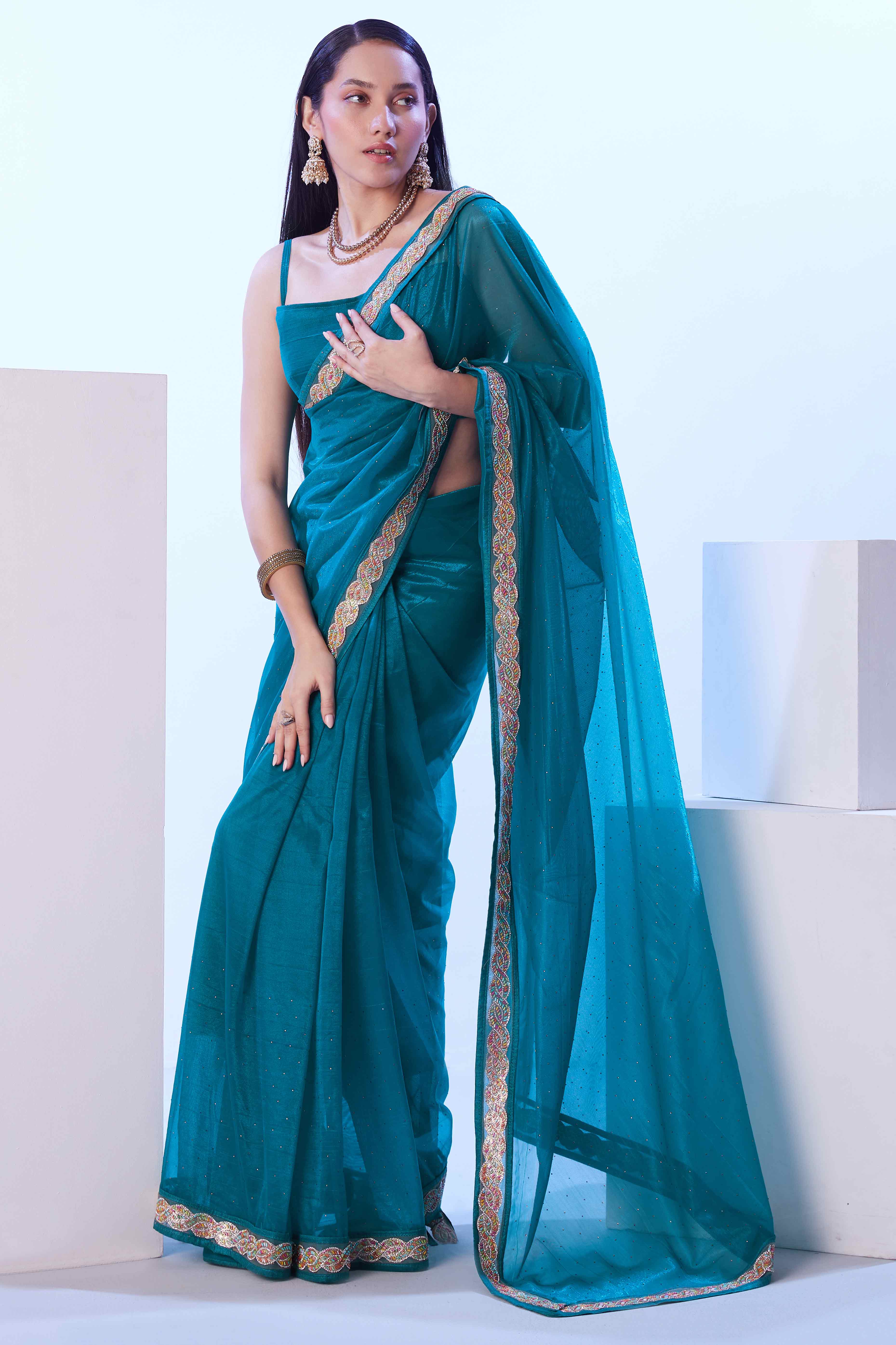 Teal Stone Work Net Solid Embroidered Saree for Party Wear