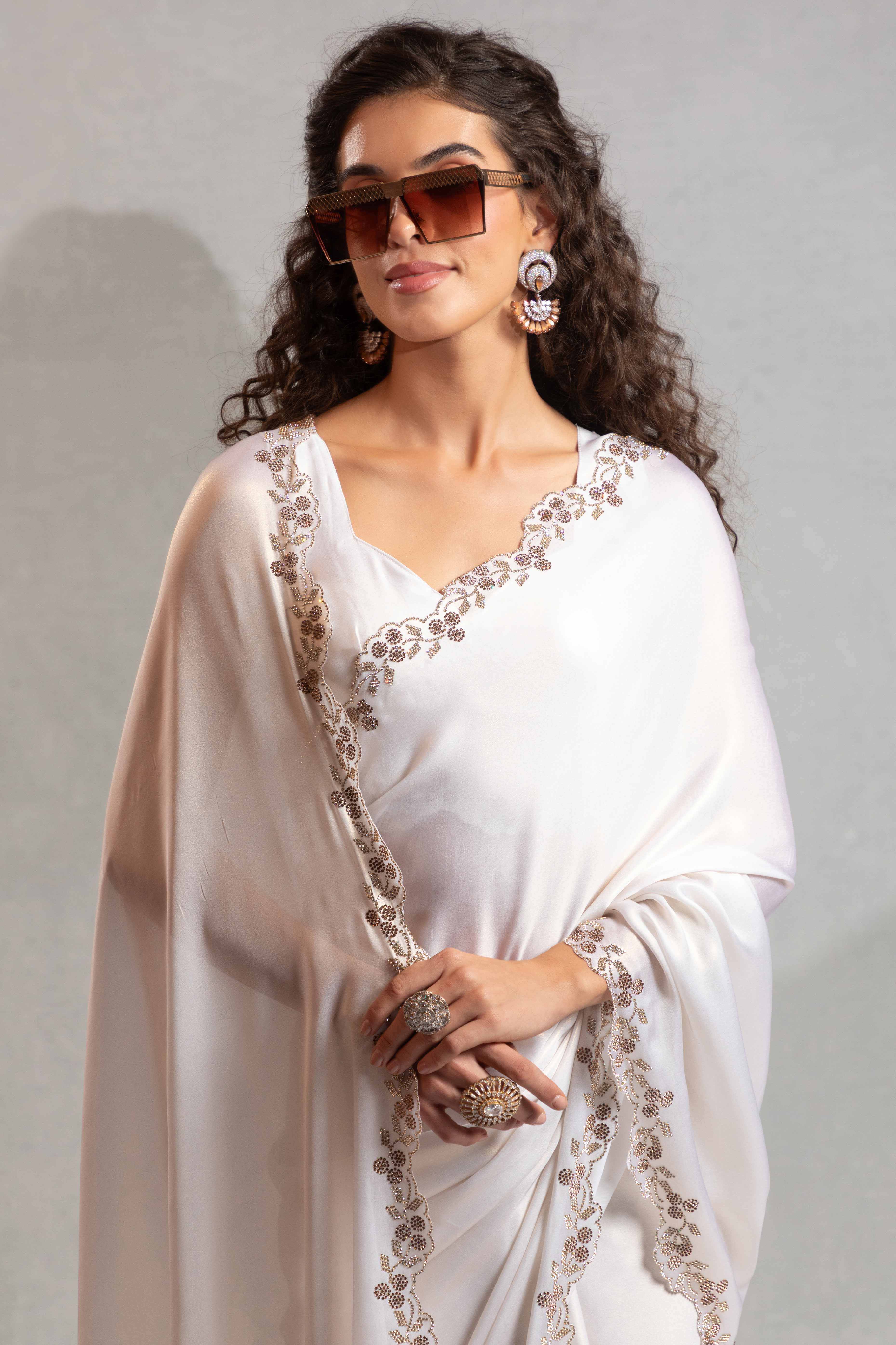 White Satin Georgette Saree Adorned With Subtle Foil Finish & A Sparkling Zarkan Work Border