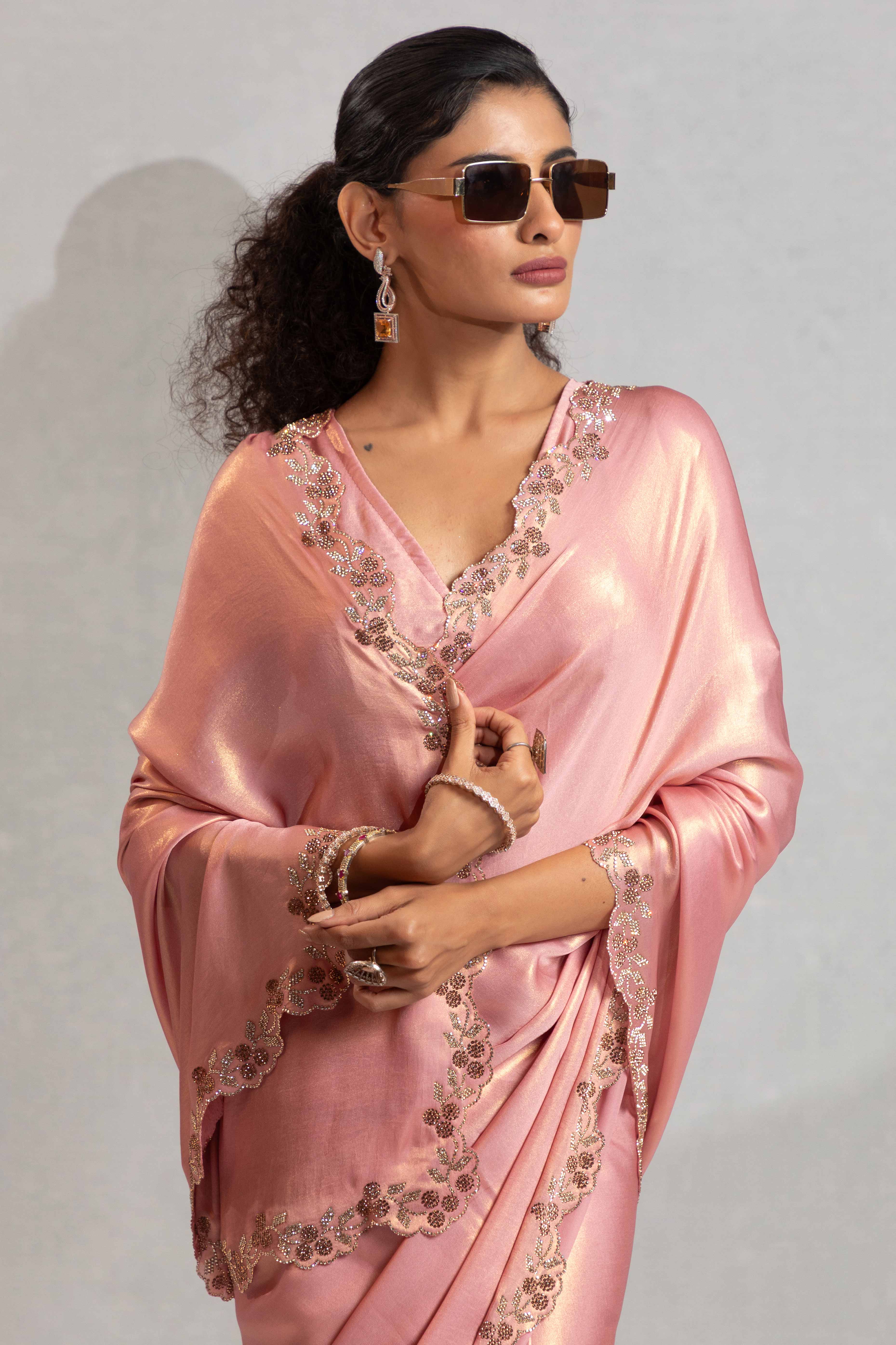 Peach Satin Georgette Saree Adorned With Subtle Foil Finish & A Sparkling Zarkan Work Border