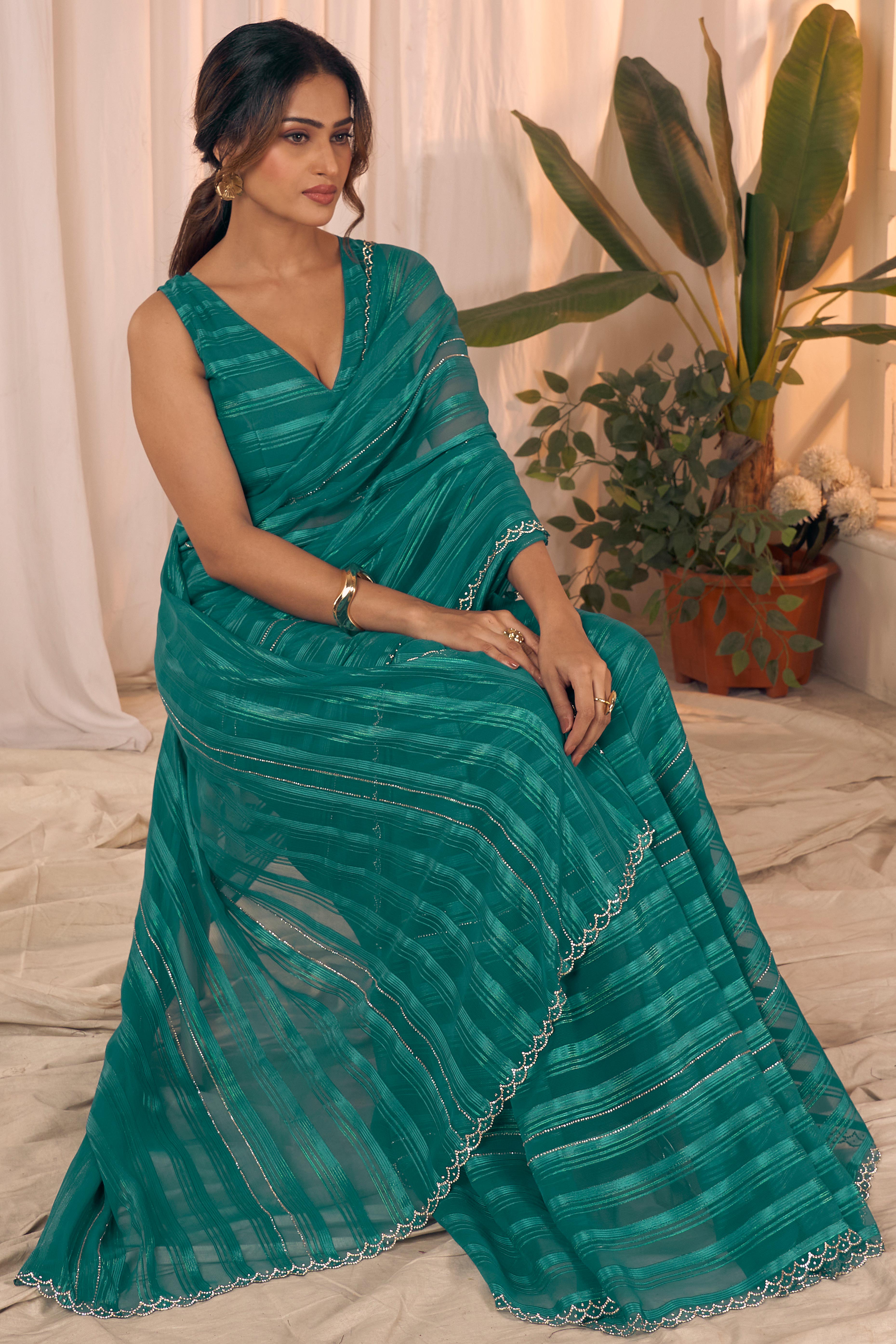 Teal Striped Designer Georgette Saree Adorned With An Elegant Zarkan Cutwork Border