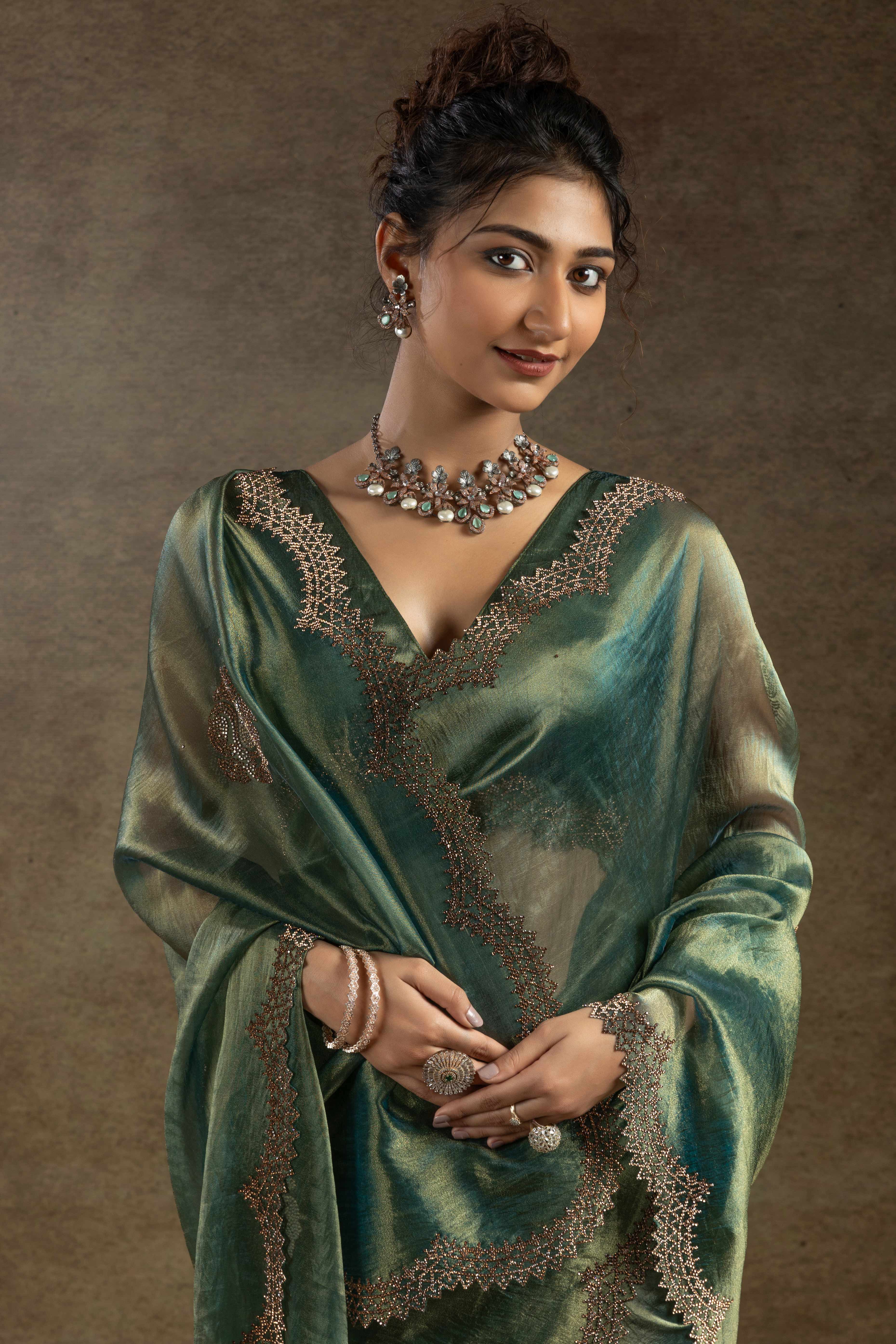 Green Banarasi Silk Saree with Stone Embellishments Perfect for Party Wear