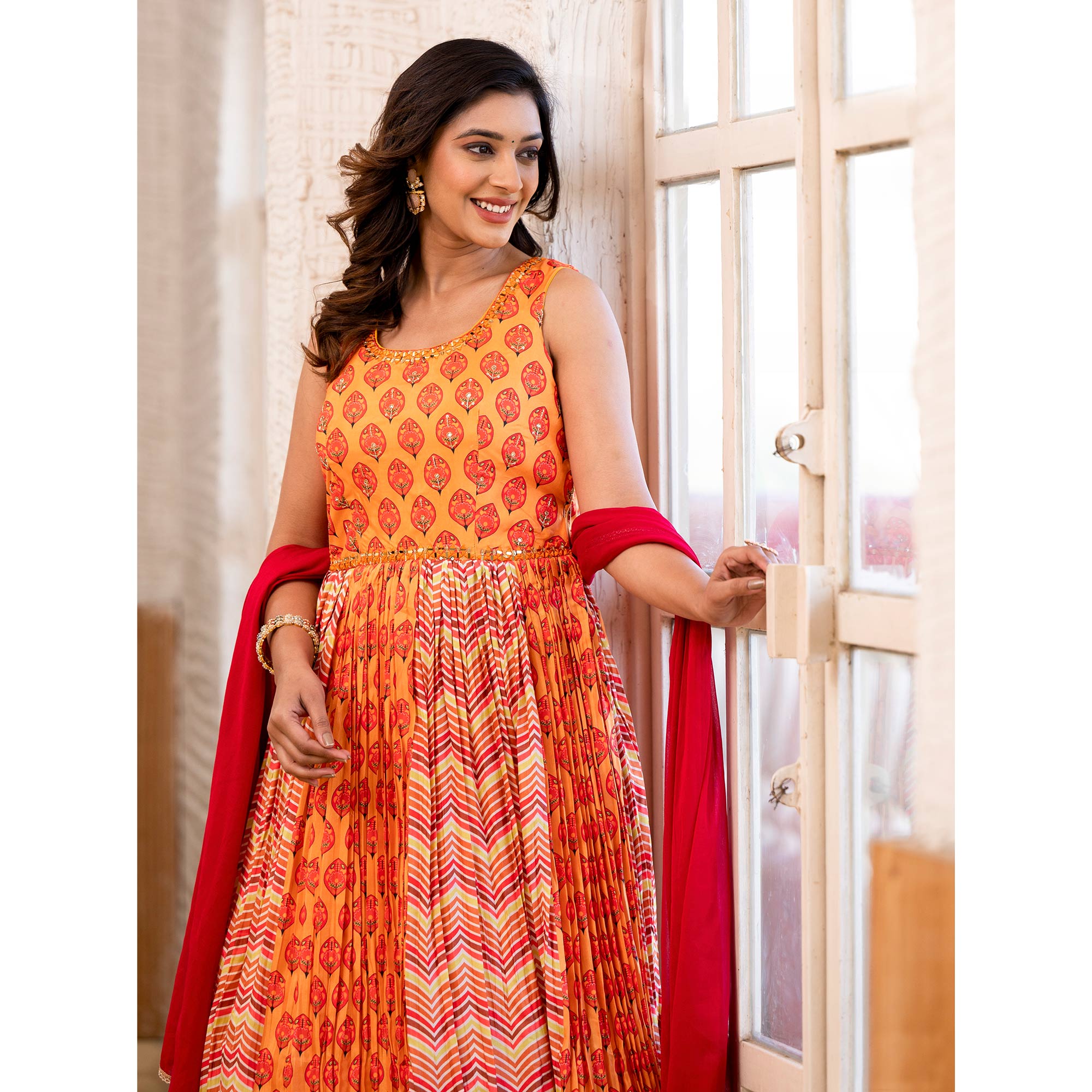 Orange Printed Dola Silk Anarkali Style Gown With Mirror Work