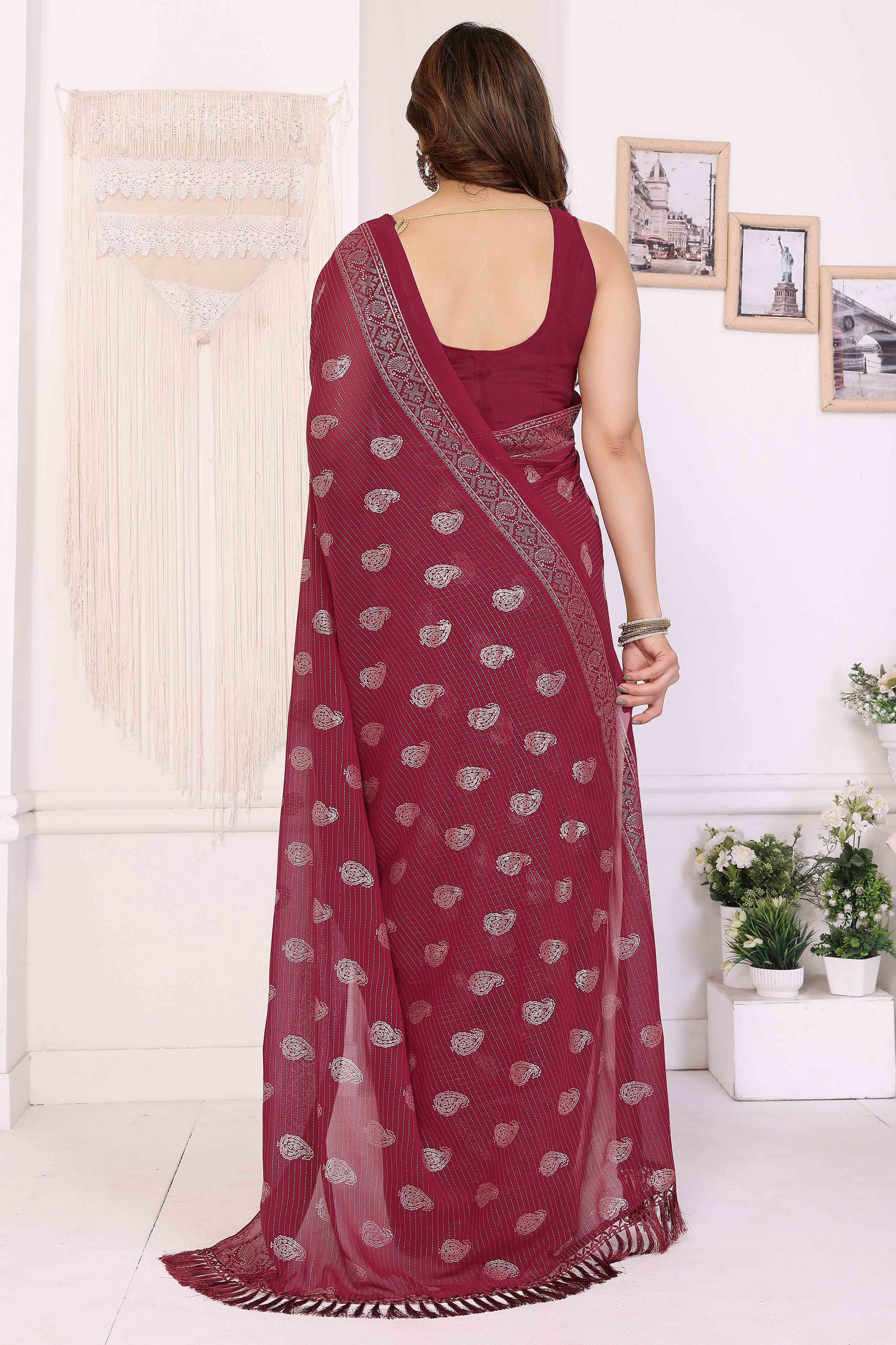 Maroon Foil Printed Georgette Saree Enhanced With Delicate Lace Border & Elegant Tassel