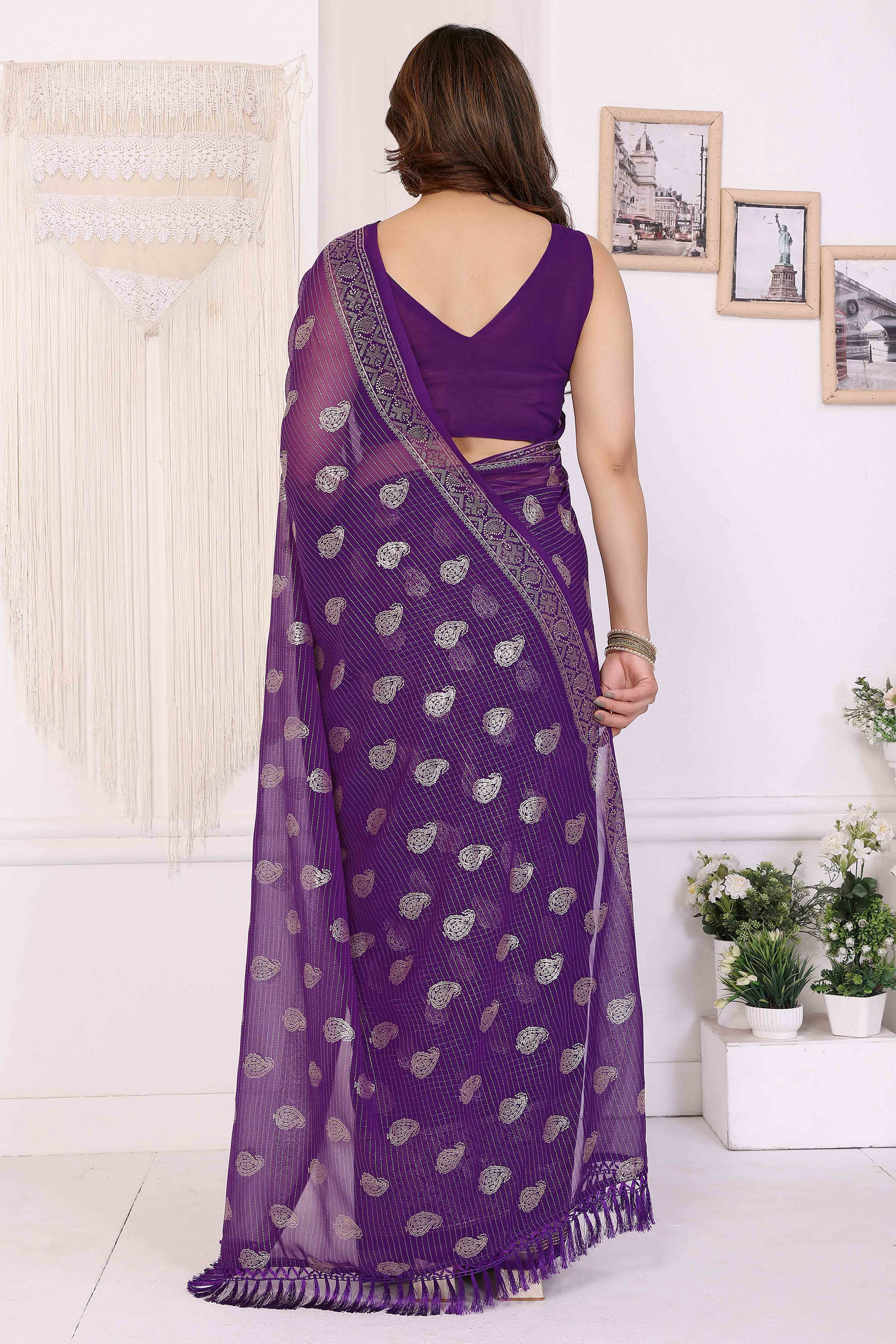 Purple Foil Printed Georgette Saree Enhanced With Delicate Lace Border & Elegant Tassel