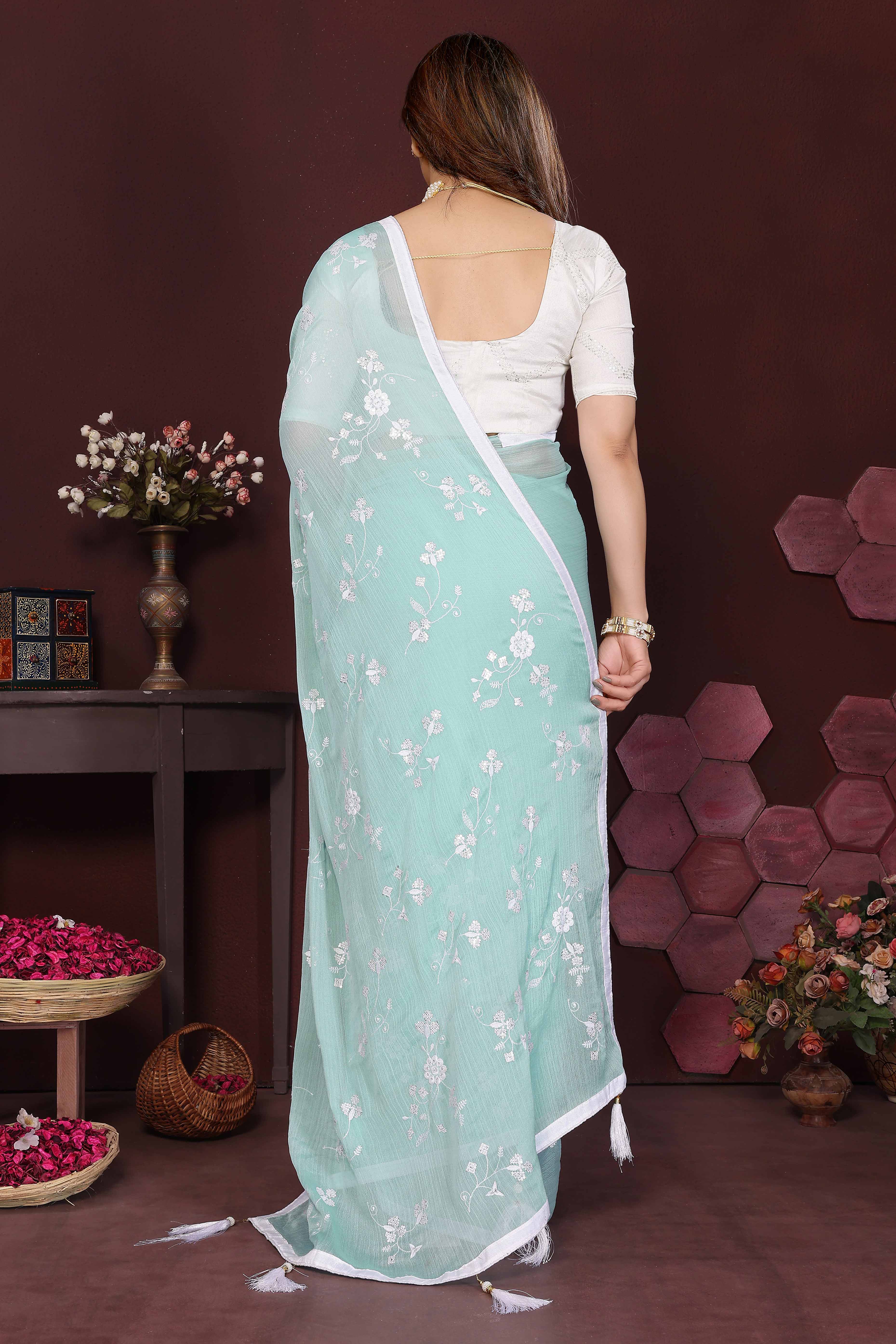 Pale Turquoise Bloom Saree adorned with Moss Floral Embroidery and Delicate Lace Border
