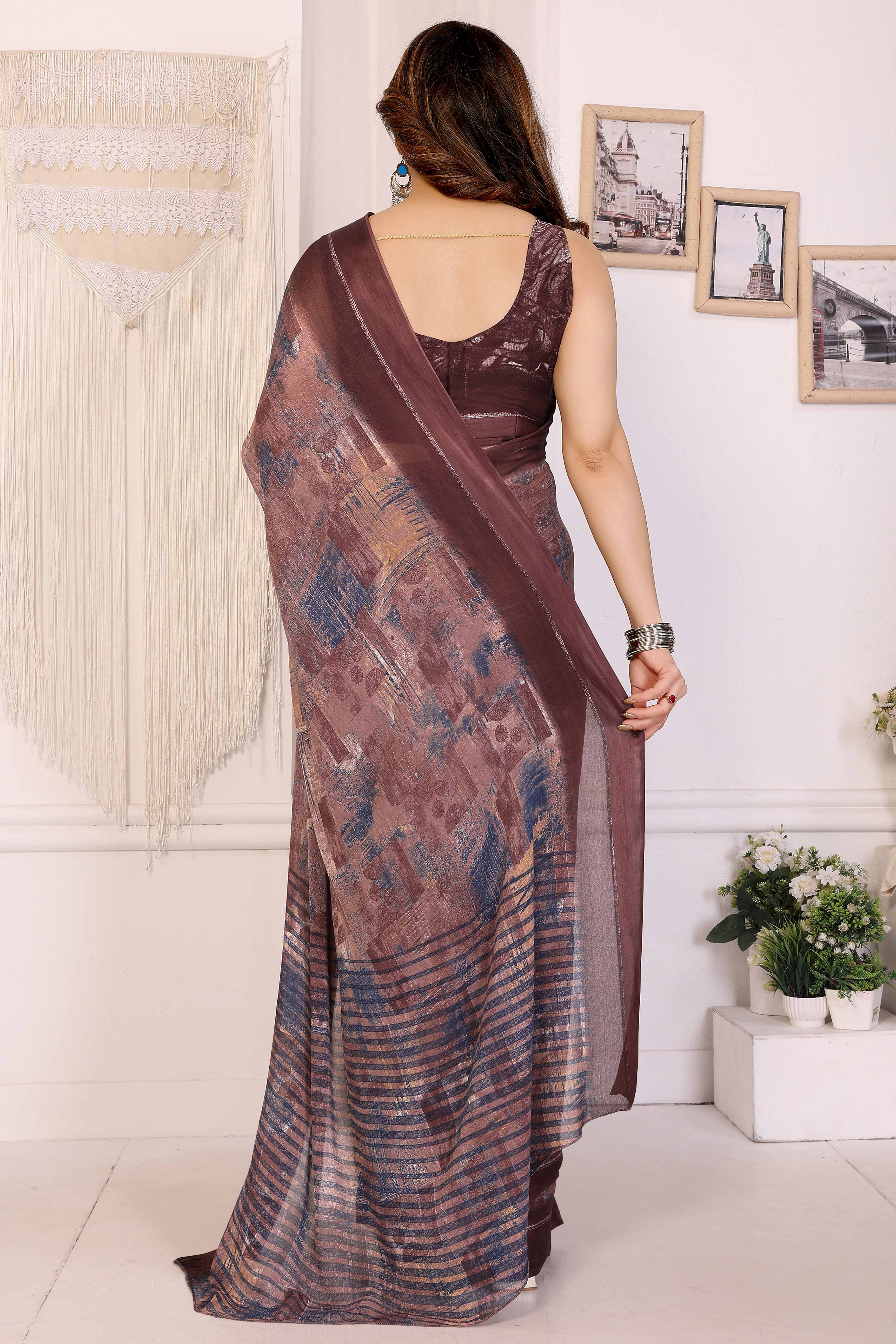 Trendy Brown Moss Crepe Saree with Floral Motifs and Satin Border