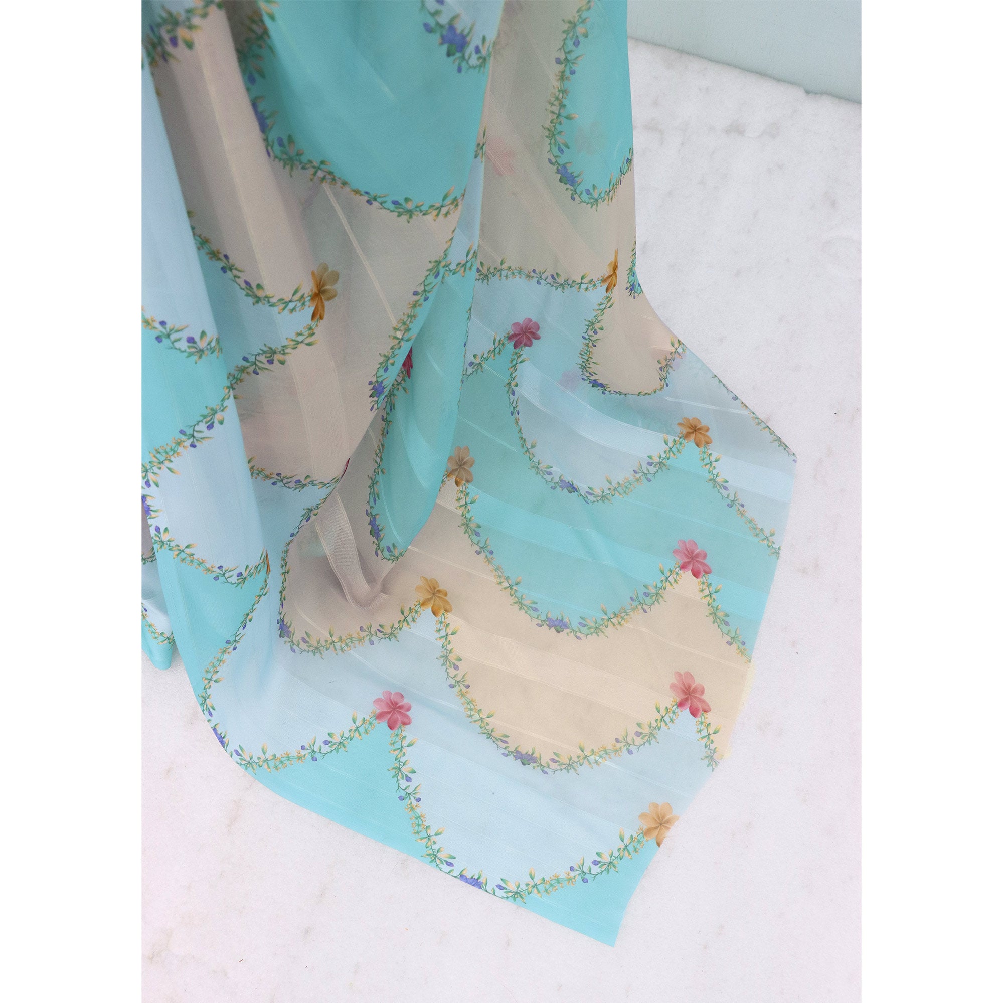 Sky Blue Bloom Floral Digital Printed Georgette Saree Accentuated With Graceful Zari Stripes