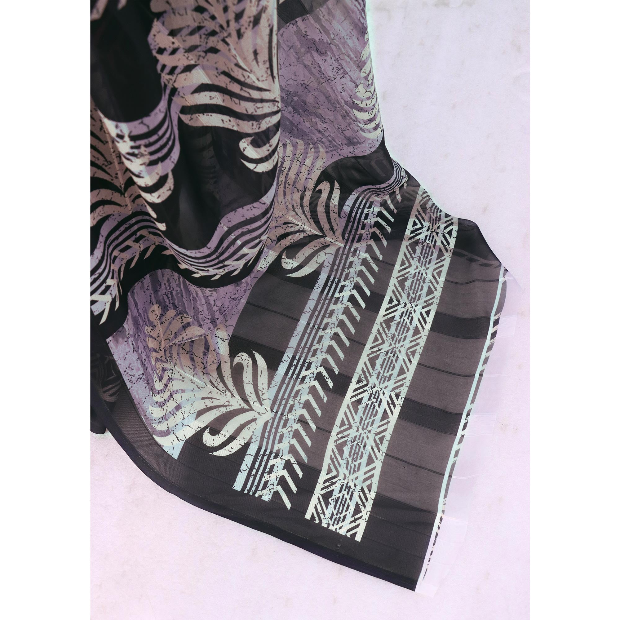 Charming Black Digital Printed Georgette Saree Accentuated With Zari Stripes