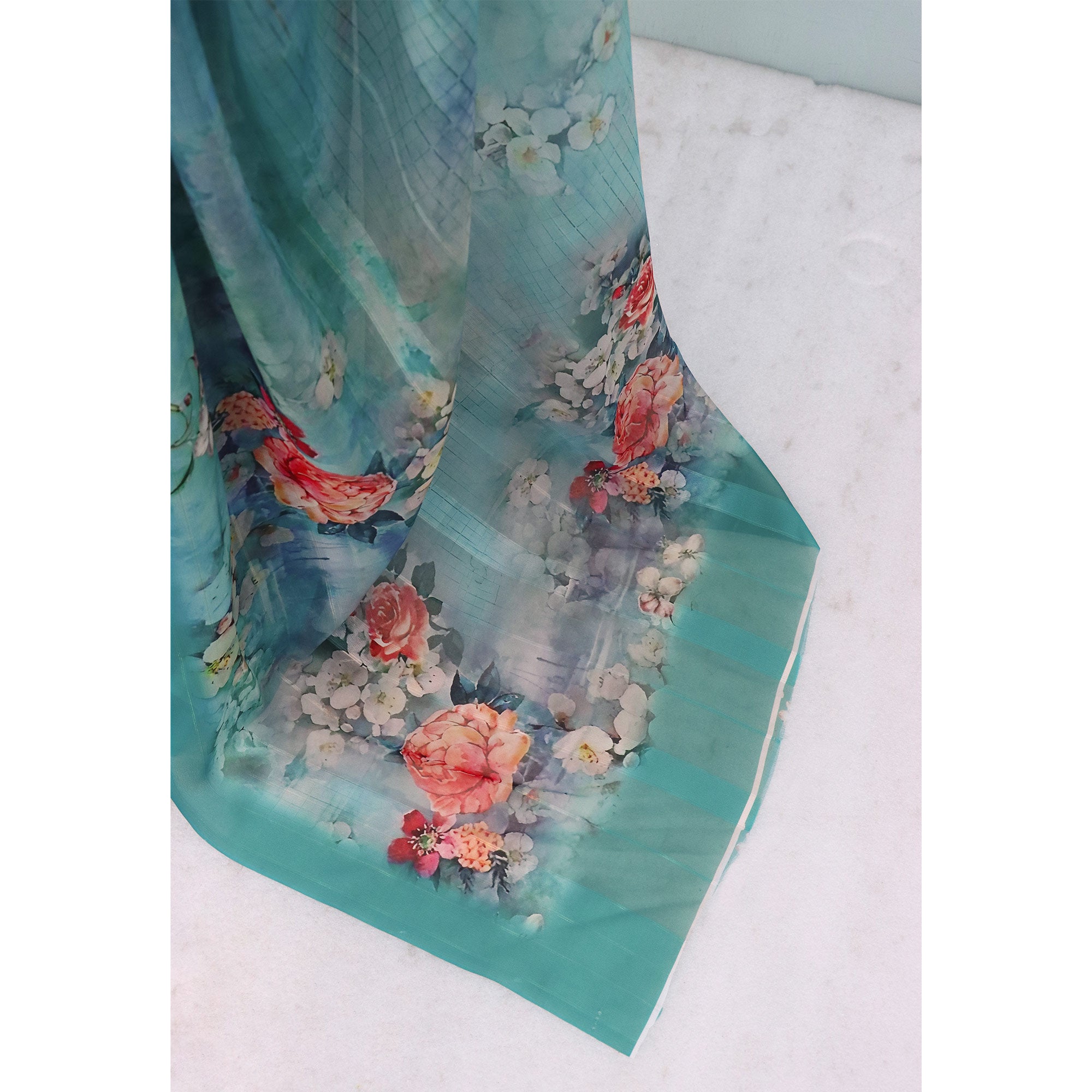 Charming Turquoise Blue Floral Digital Printed Georgette Saree Accentuated With Zari Stripes