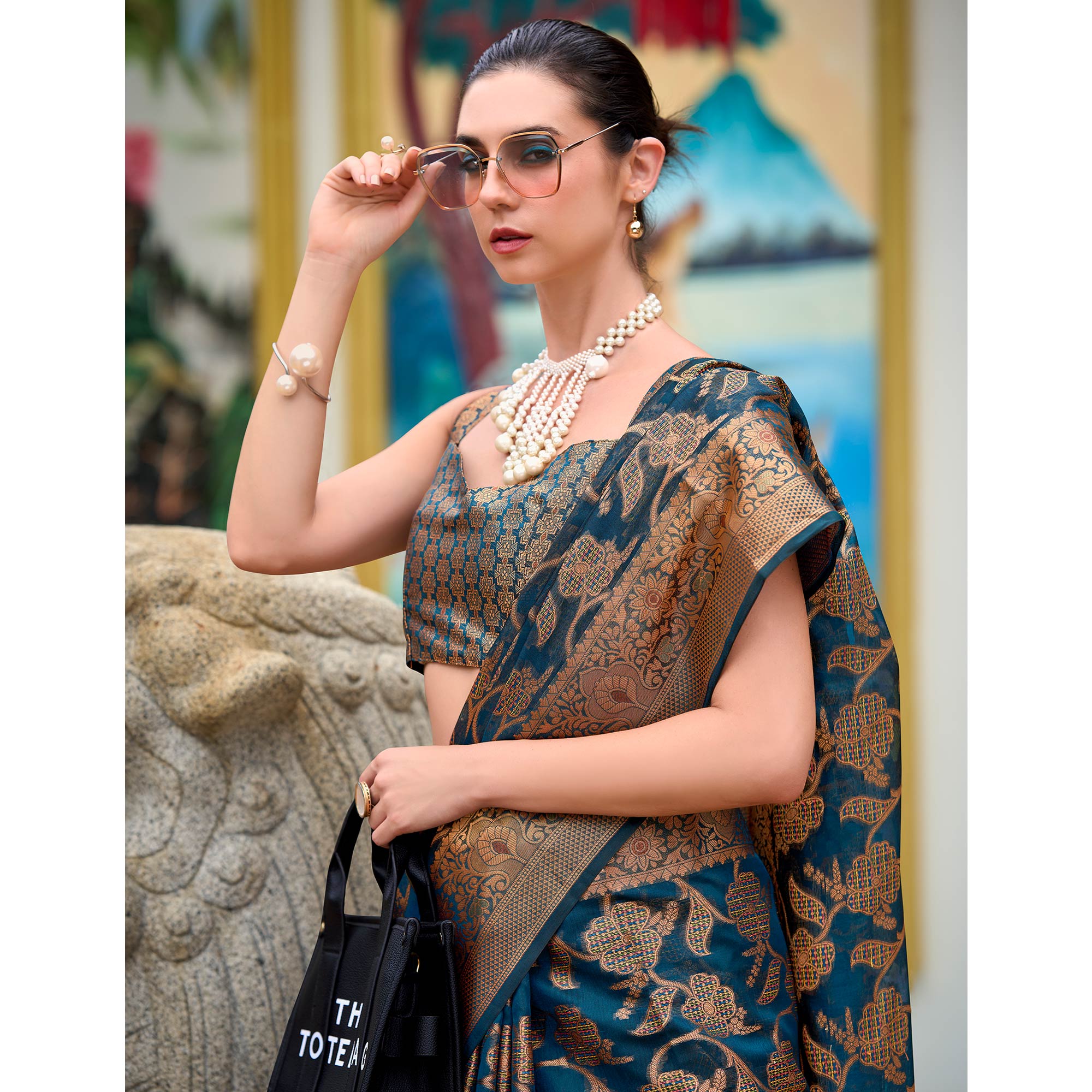 Teal Floral Motifs Woven Organza Saree