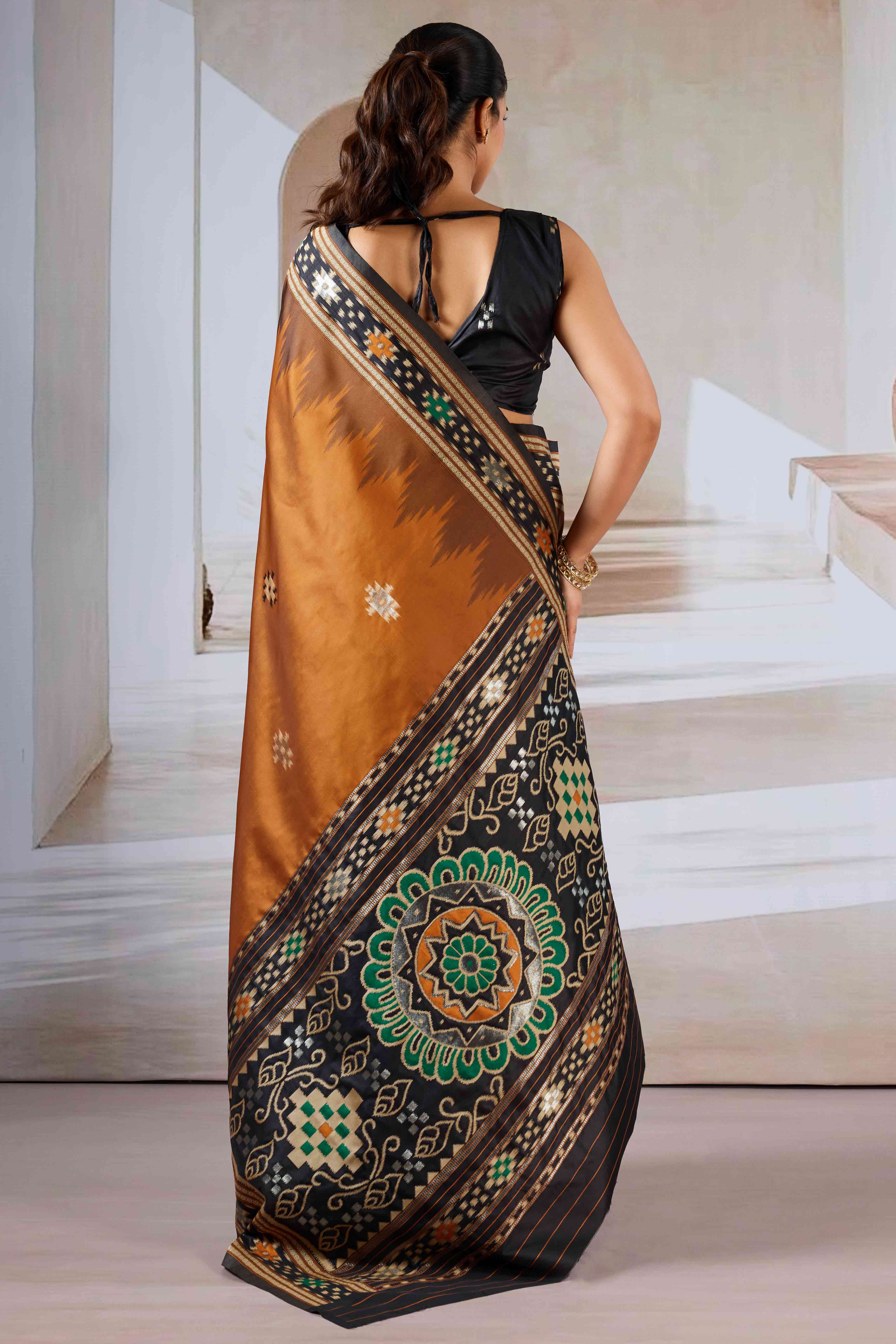 Brown Art Silk Saree Adorned with Intricate Patola Style Woven Designs