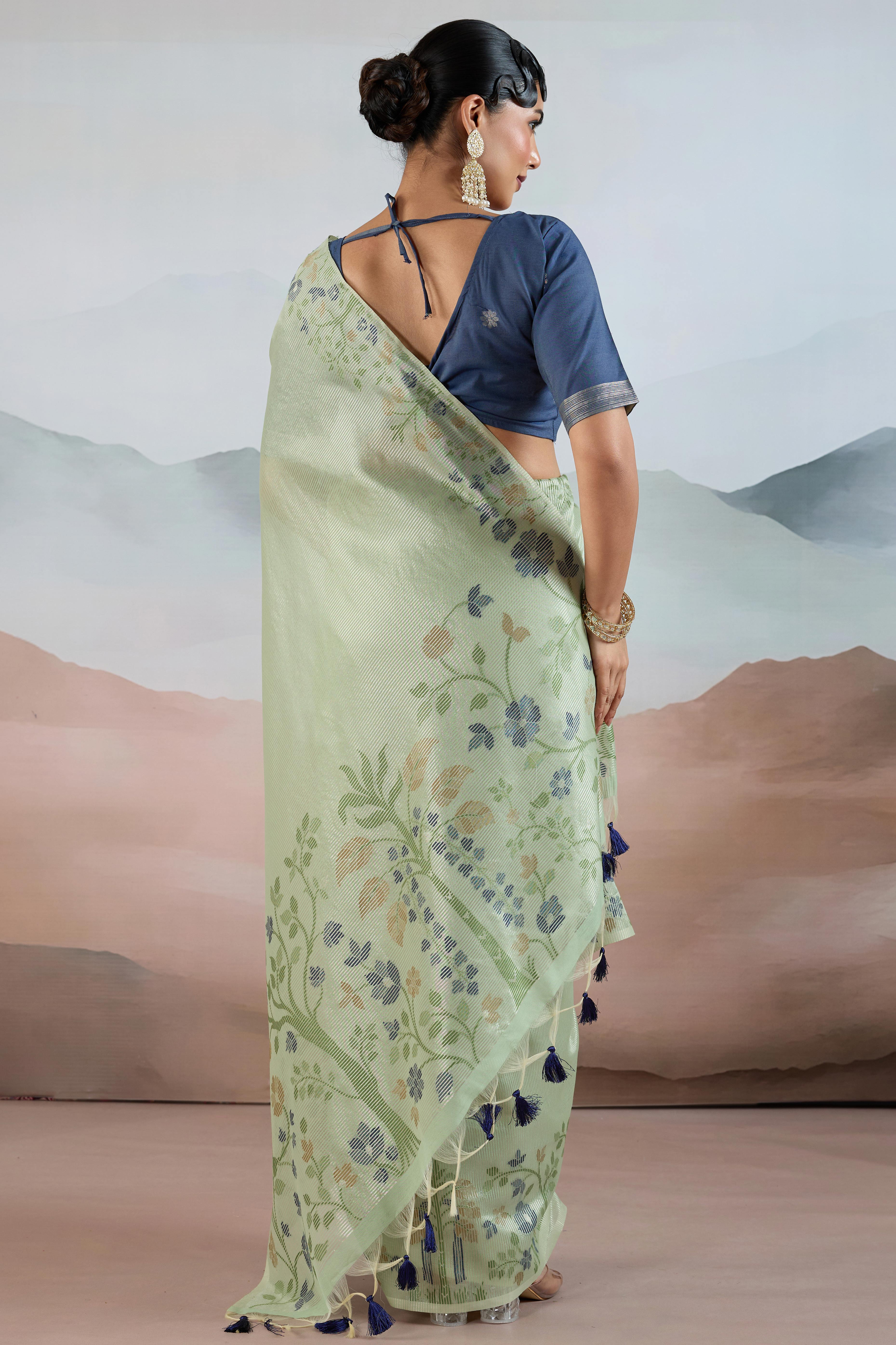 Green Tissue Silk Saree Showcasing Floral & Striped Weaving With Tassel Adornment