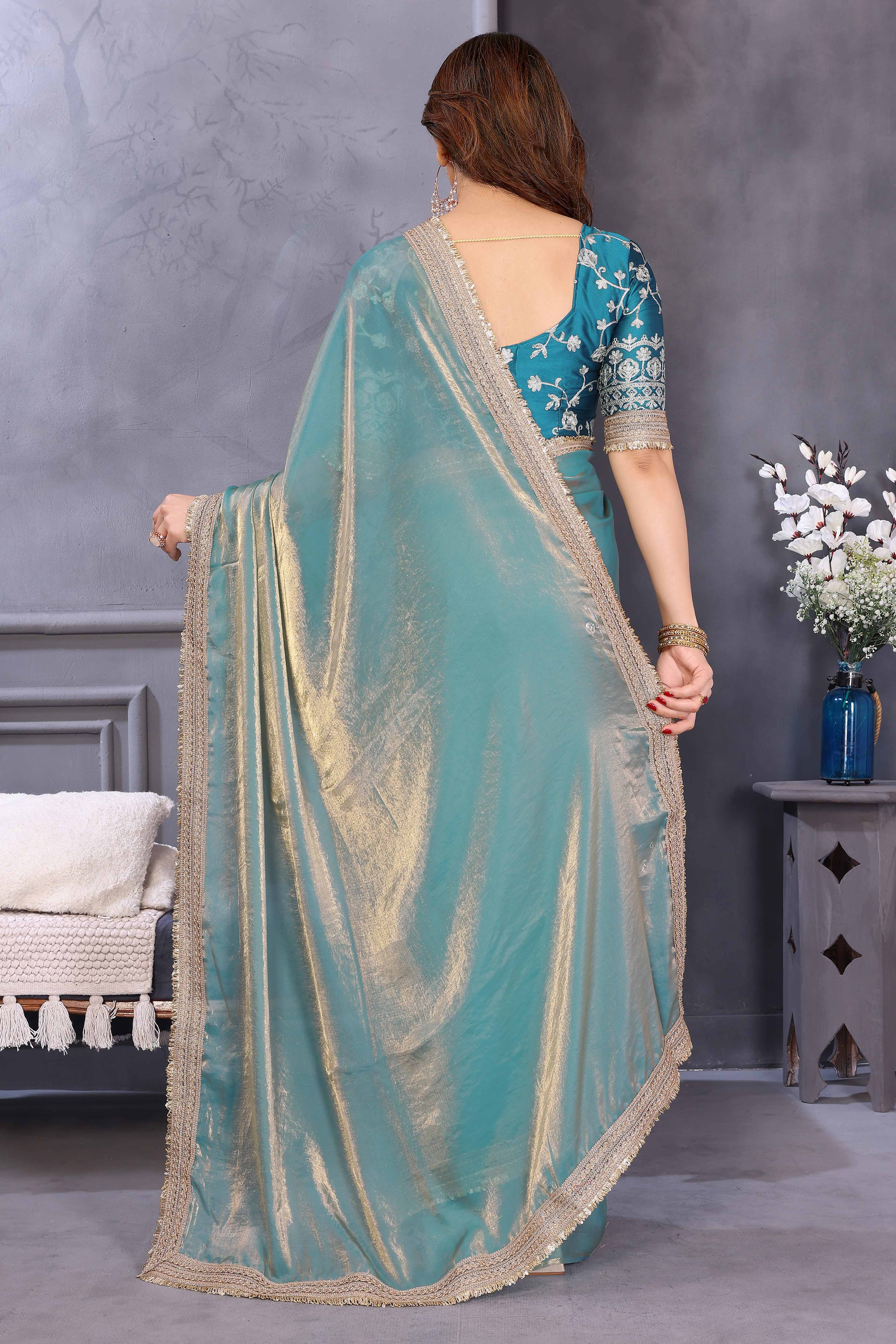 Teal Satin Saree with Solid Body and Decorative Lace Embellished Border – A Modern Ethnic Staple
