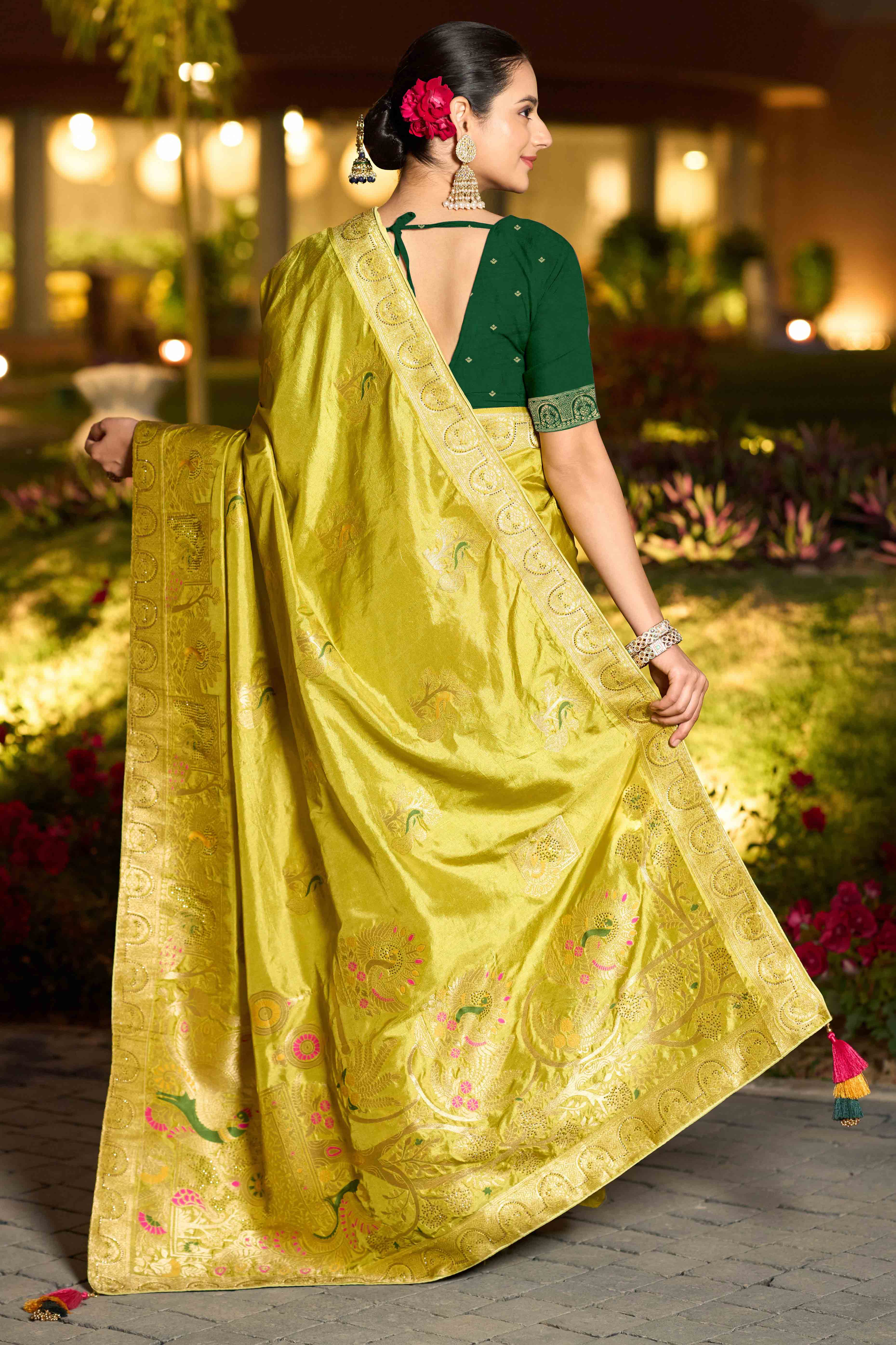 Graceful Green Dola Silk Saree With Intricate Zari Weaving & Sparkling Swarovski Accents