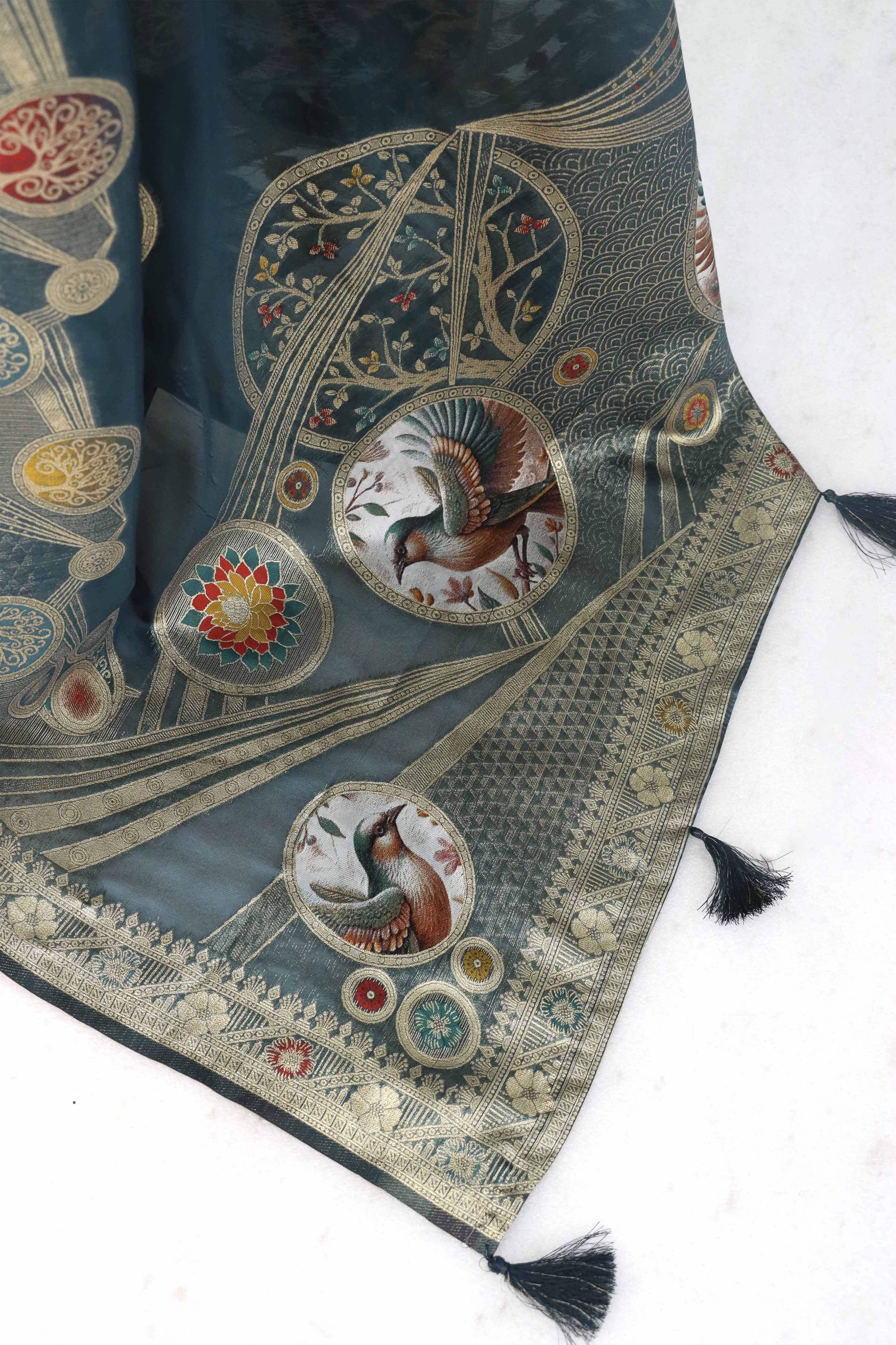 Charming Morpich Blue Zari Woven Floral Organza Saree Accented With Digital Printed Pallu & Latkan