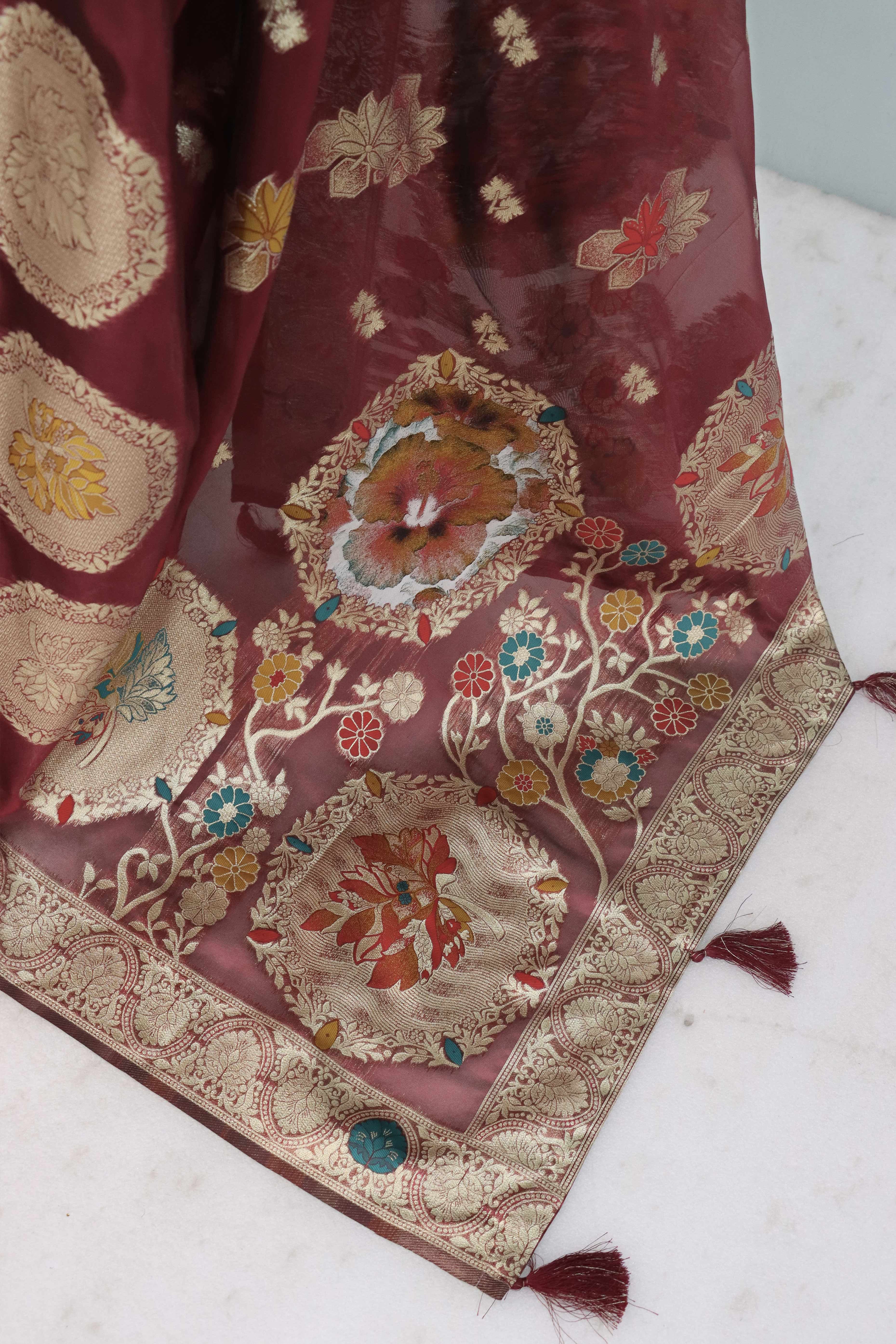 Charming Burgundy Zari Woven Floral Organza Saree Accented With Digital Printed Pallu & Latkan