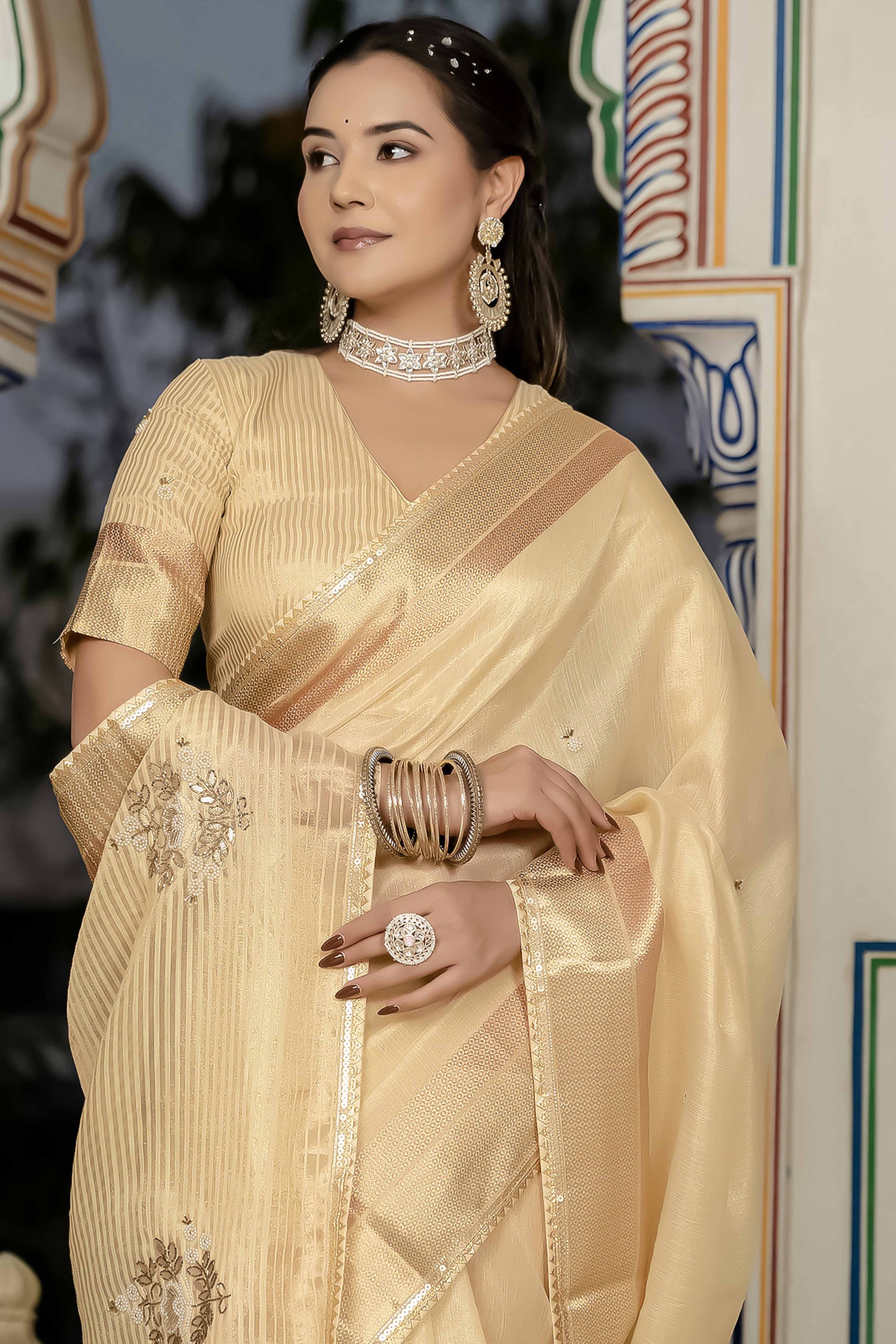Beige Tissue Linen Saree Featuring Intricate Zari and Beadwork