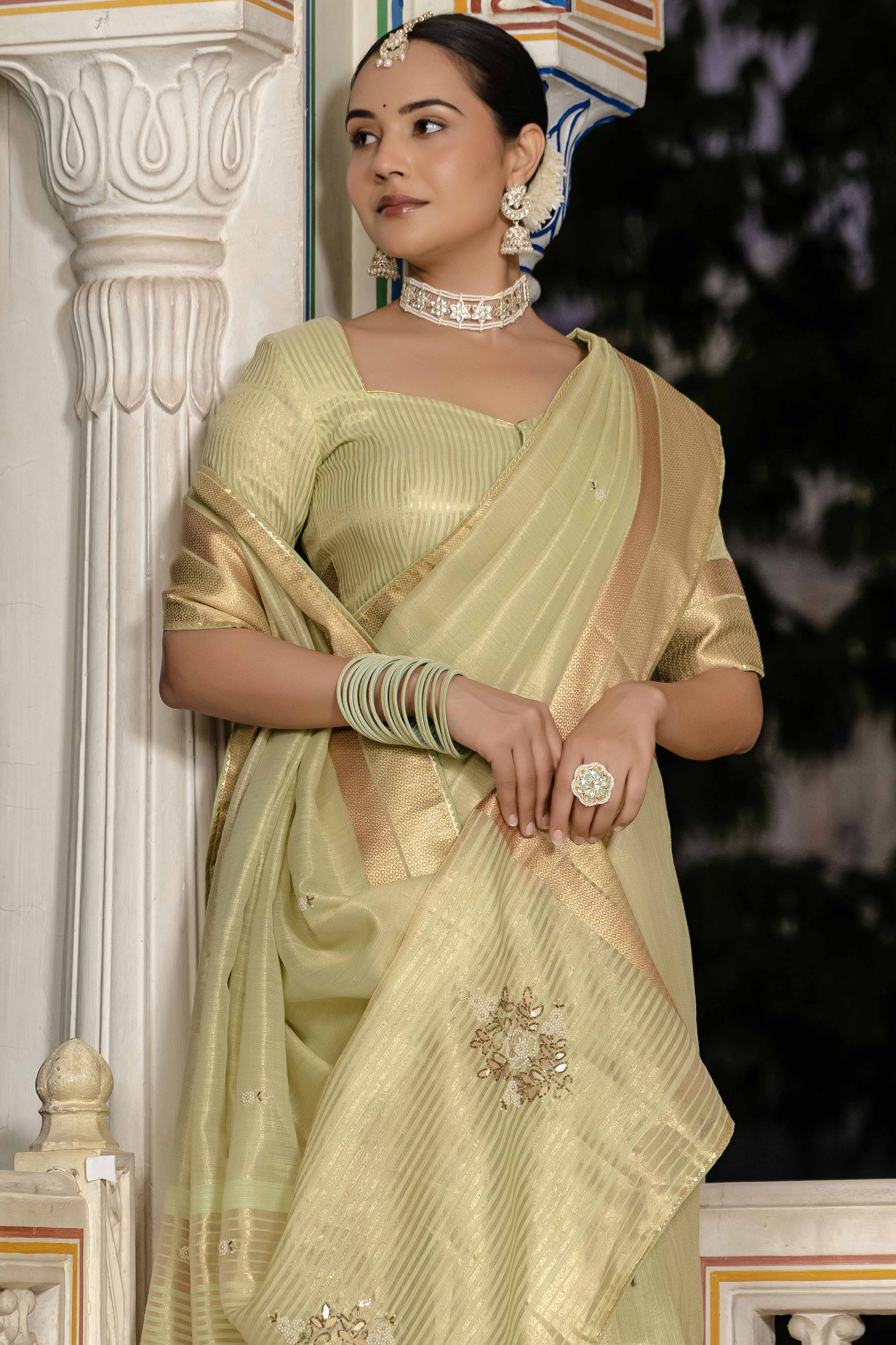 Green Tissue Linen Saree Featuring Intricate Zari and Beadwork