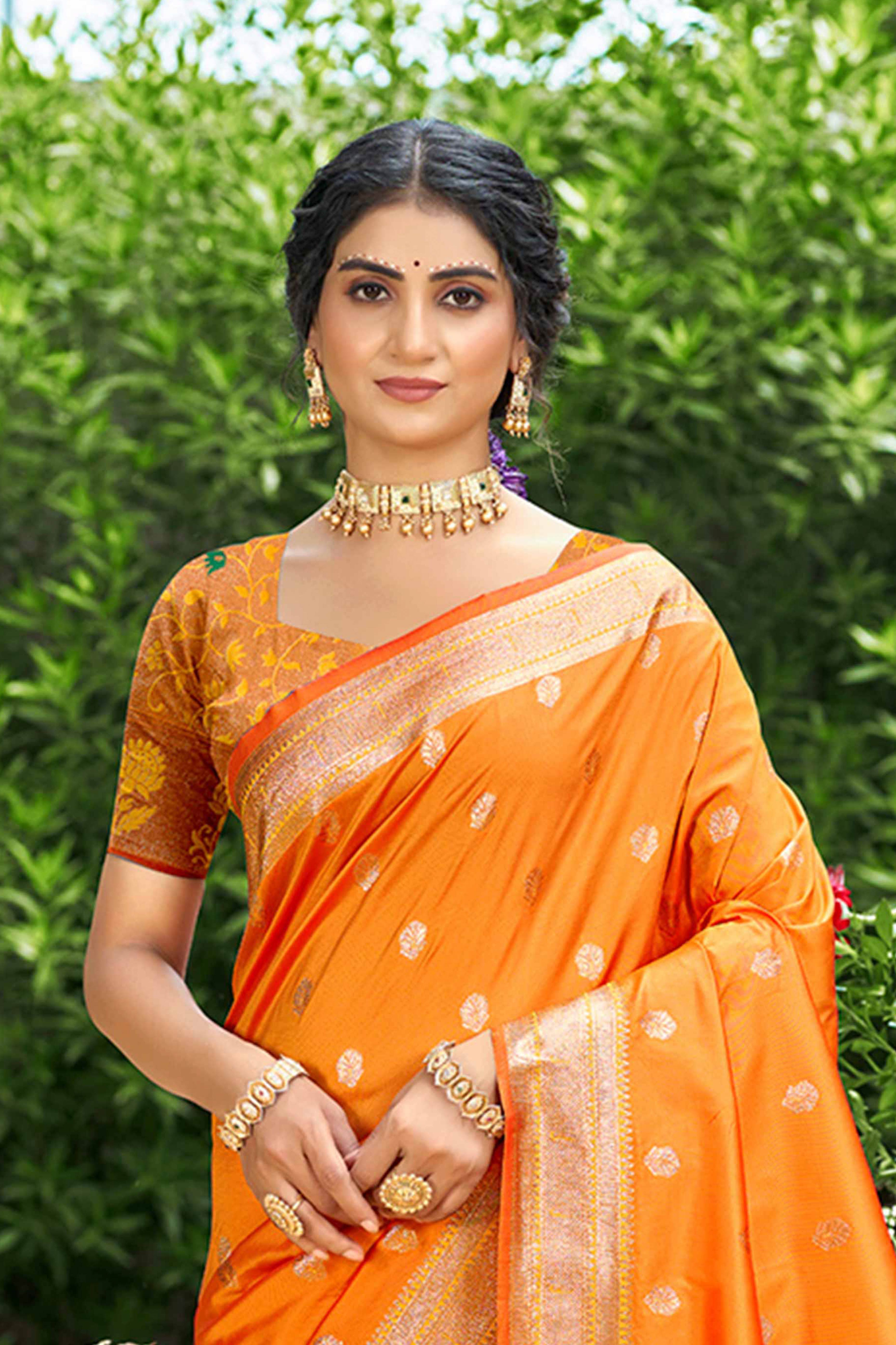 Orange Zari Weaving Silk Blend Saree Adorned With Intricate Peacock Motif Pallu & Graceful Tassel