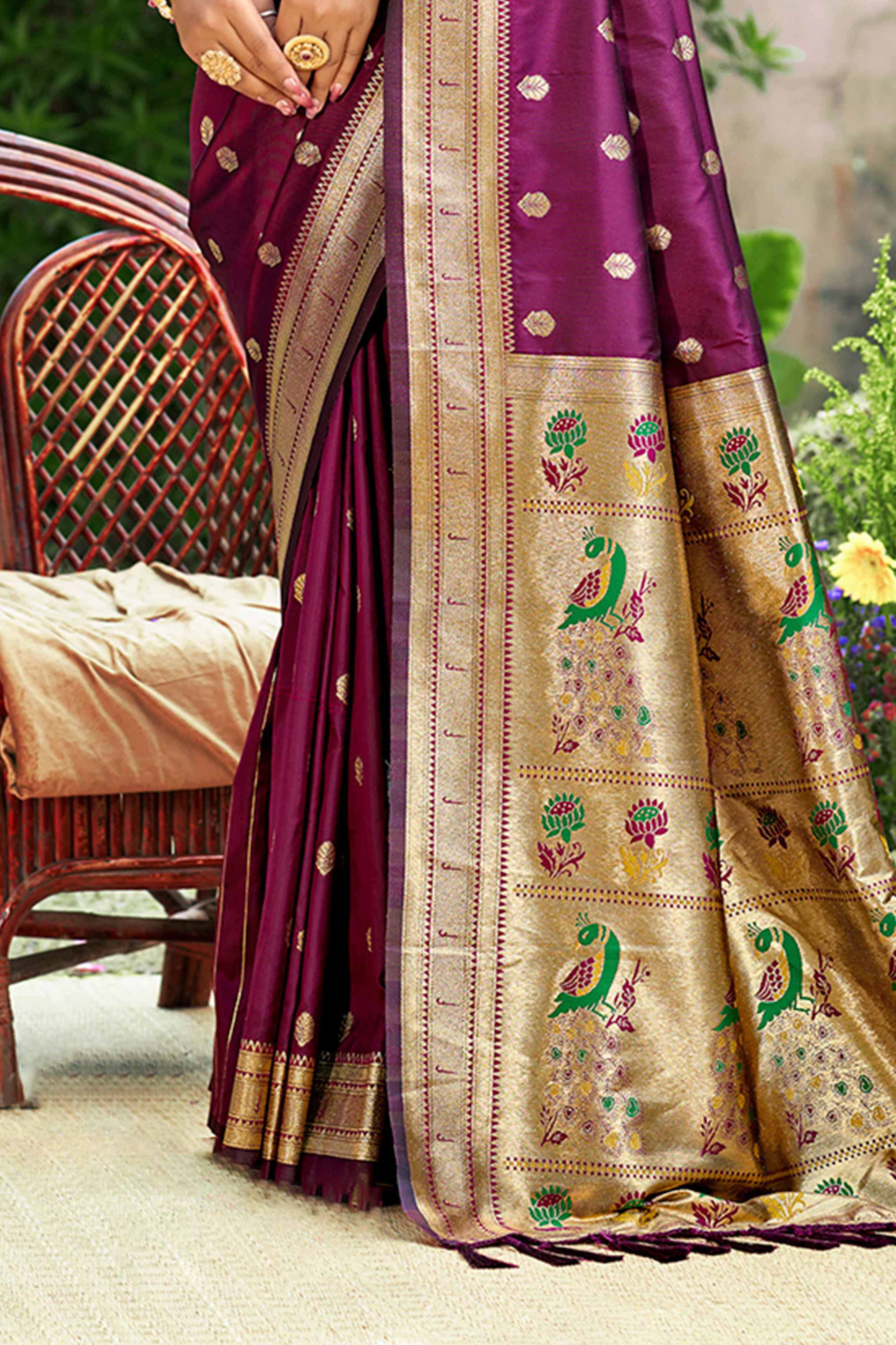 Wine Zari Weaving Silk Blend Saree Adorned With Intricate Peacock Motif Pallu & Graceful Tassel