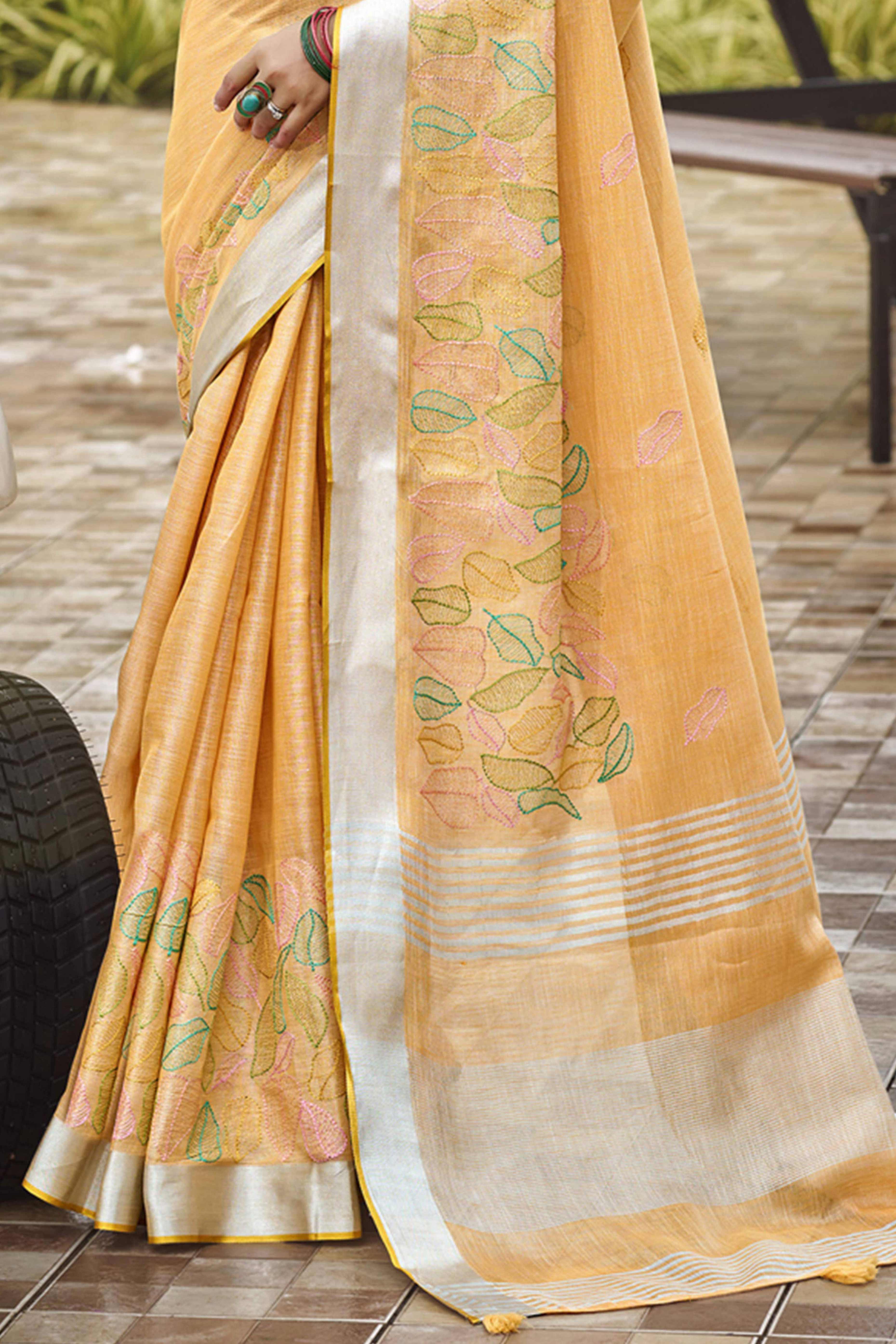 Classic Light Orange Leaf Pattern Thread Embroidery Work Linen Saree With Tassel Pallu