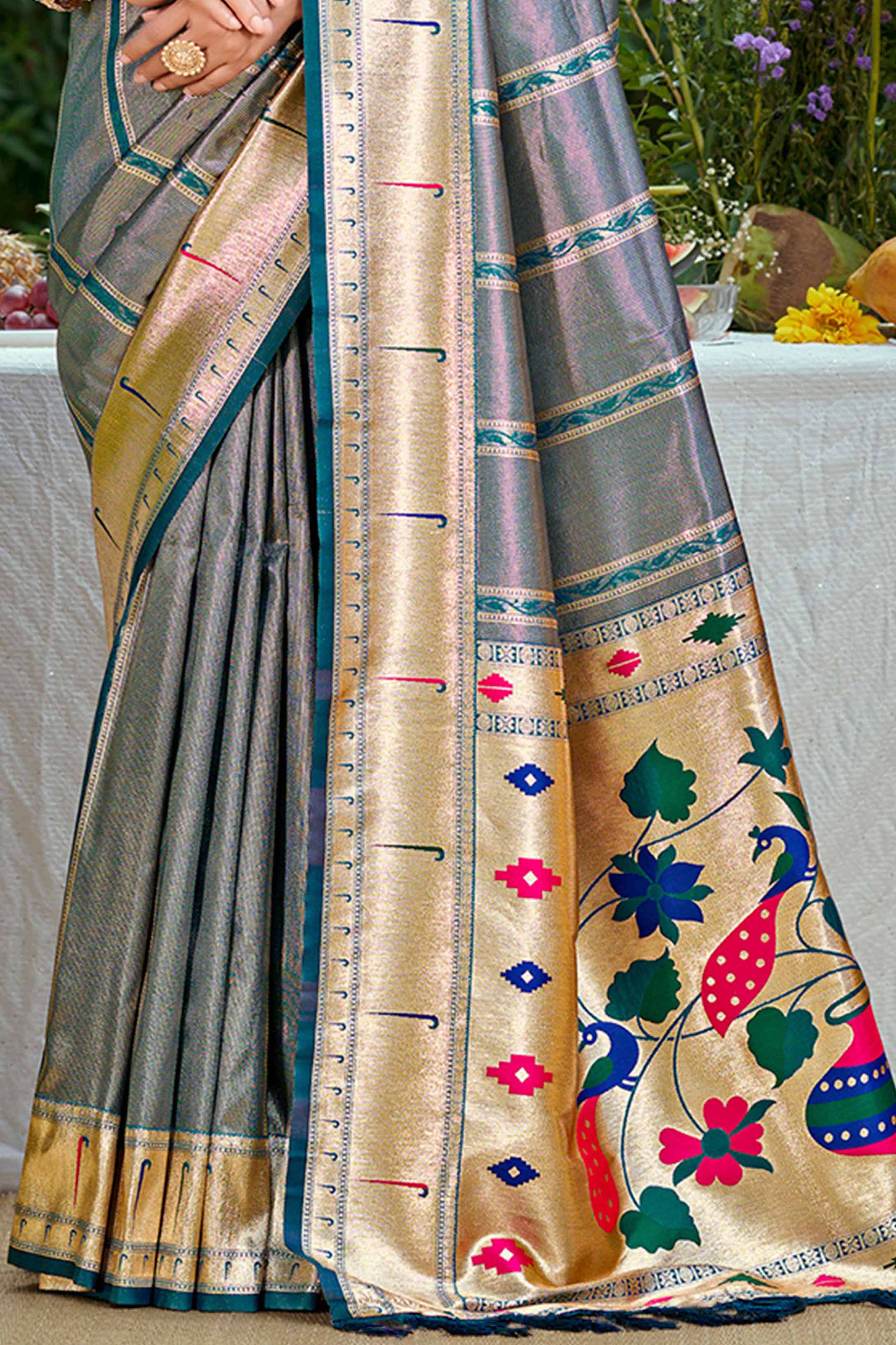 Teal Designer Weaving Silk Blend Saree Accented With Graceful Peacock & Floral Motif Pallu
