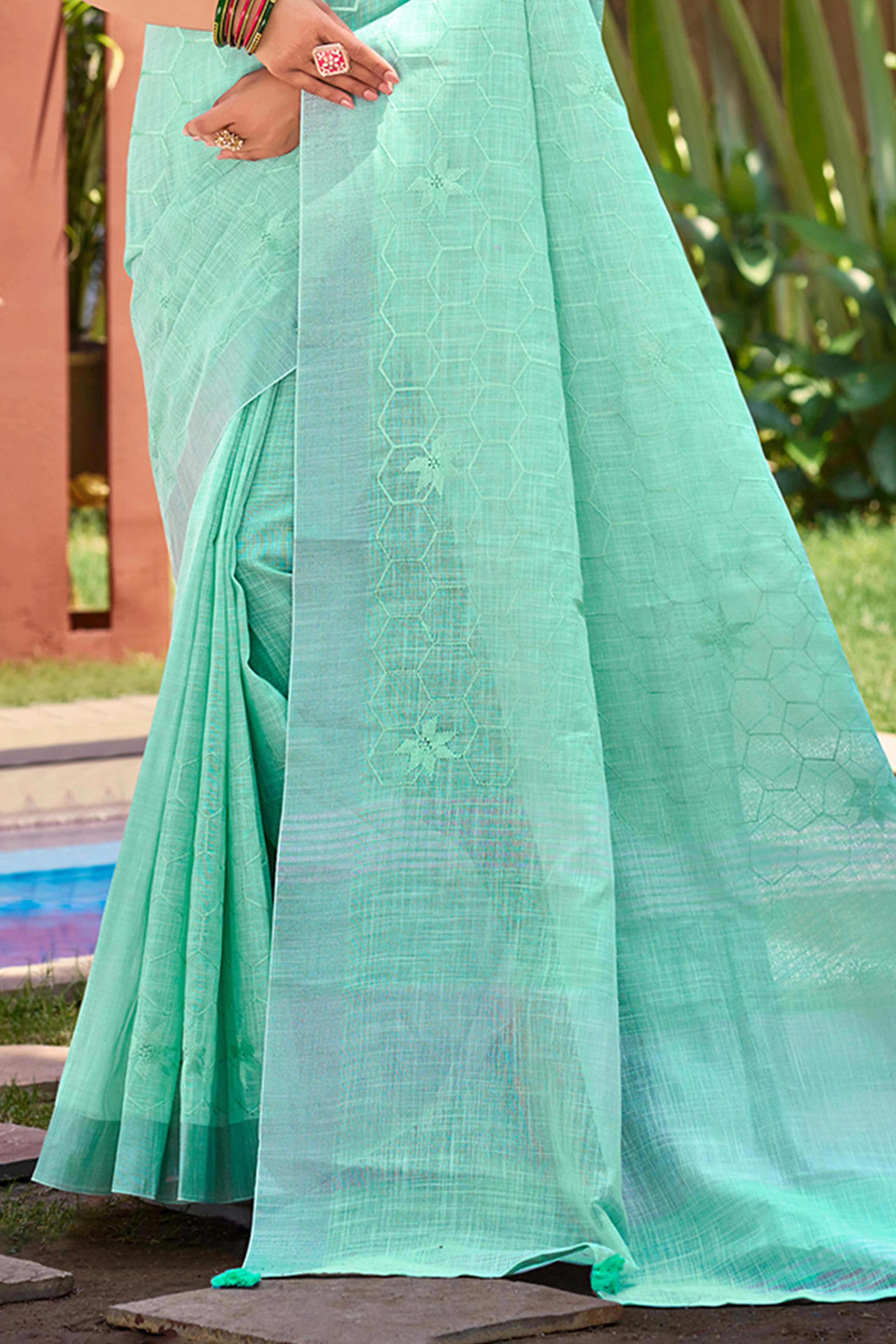 Turquoise Classic Linen Saree Enhanced With Fine Geometric Embroidery Work & Tassel Pallu