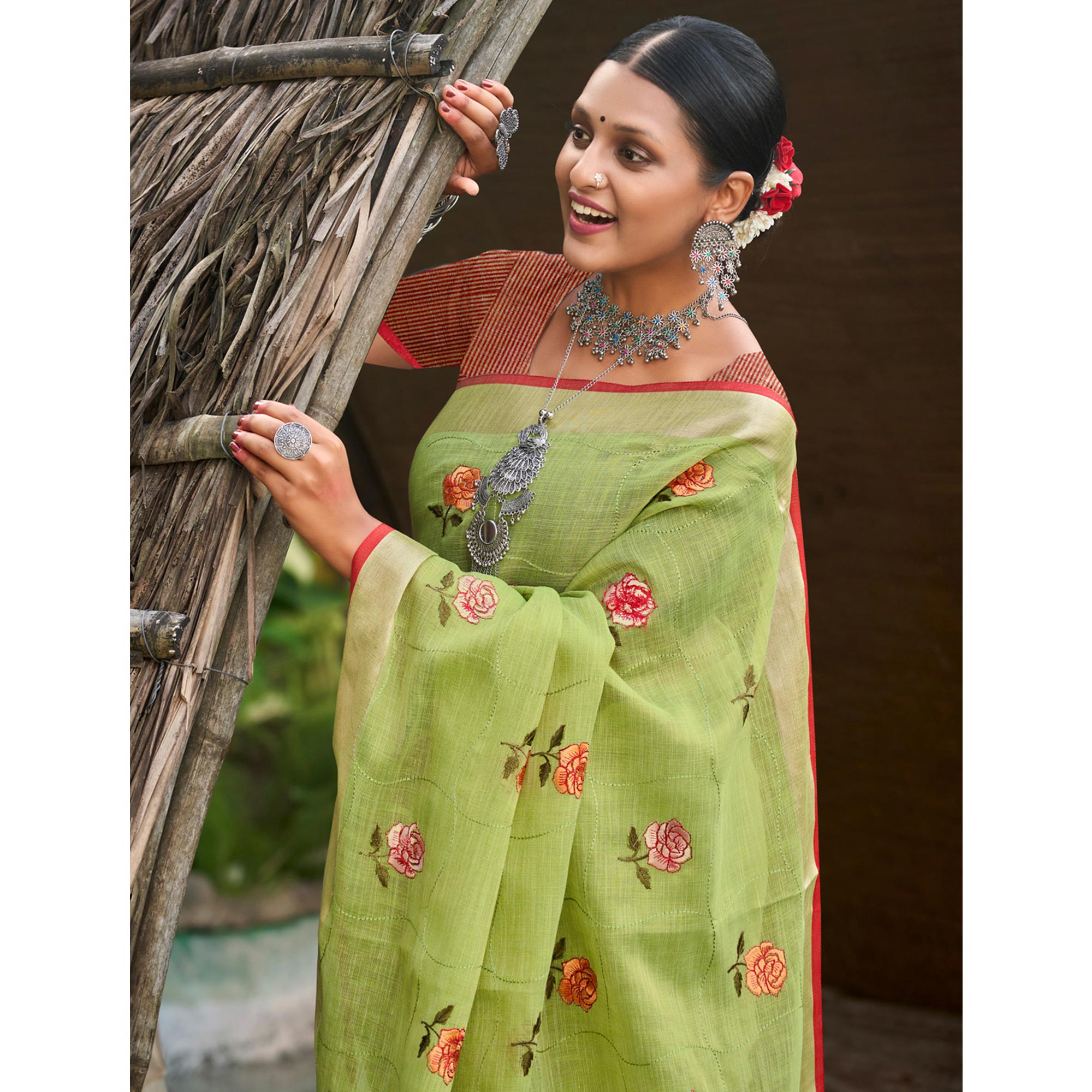 Green Floral Embroidered Linen Saree With Tassels